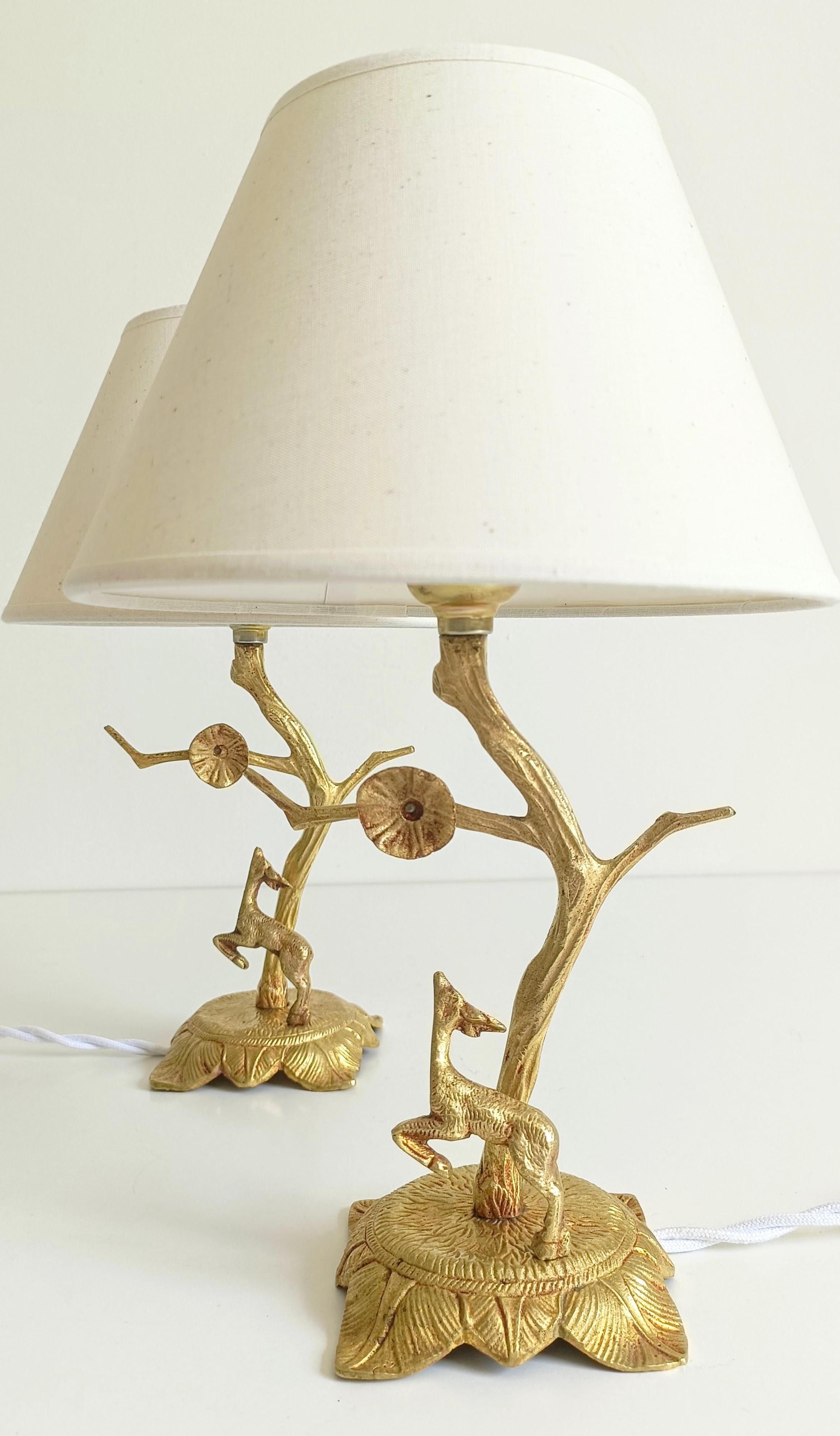 Pair of Mid-Century Bronze Deer Table Lamps in Louis XVI Style

A unique pair of Mid-Century sculptural bronze table lamps, each featuring a tree-like base with a leaping deer—an homage to the naturalistic themes of the Louis XVI period. The design