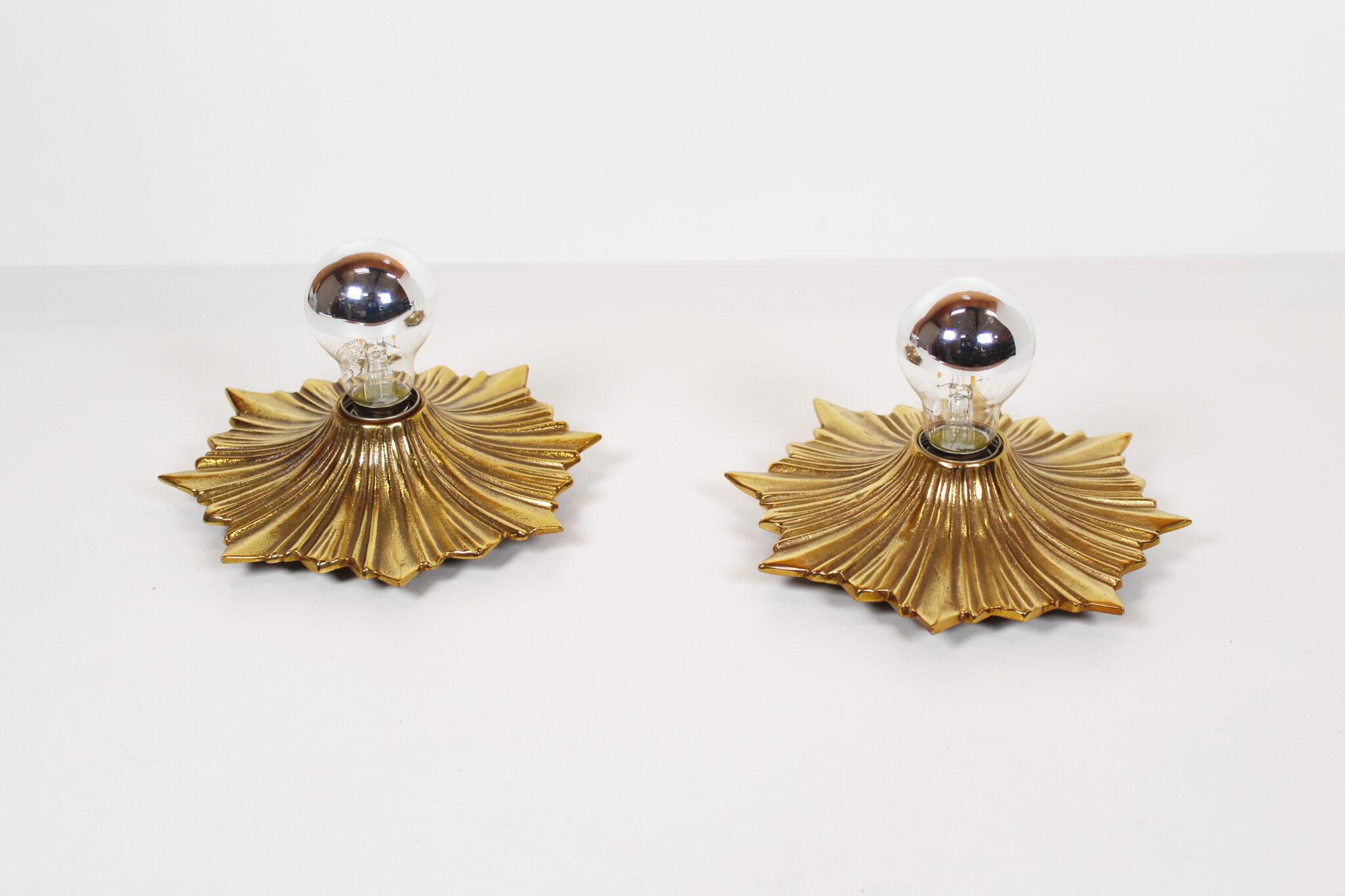 Heavy mid-century bronze sunburst fixtures that can be used as sculptural wall sconces or compact flush mount ceiling lights—rewired, E27-ready, and ideal for Hollywood Regency, Italian mid-century, or eclectic interiors.

This striking pair of