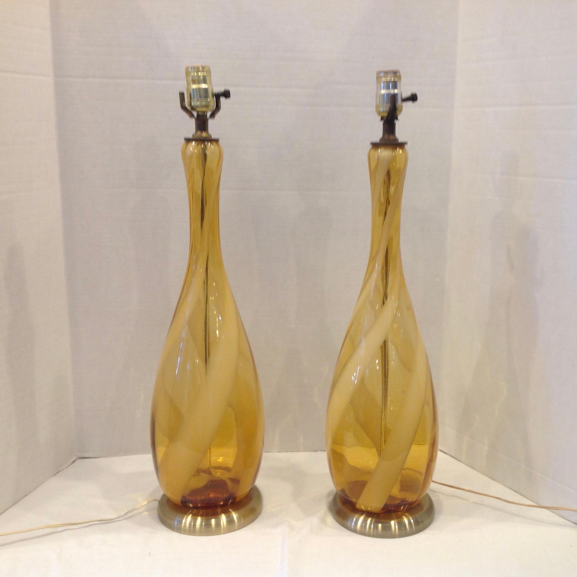 Wonderful color and height mounted on brass tone bases.
Lamps are measured to base of sockets.