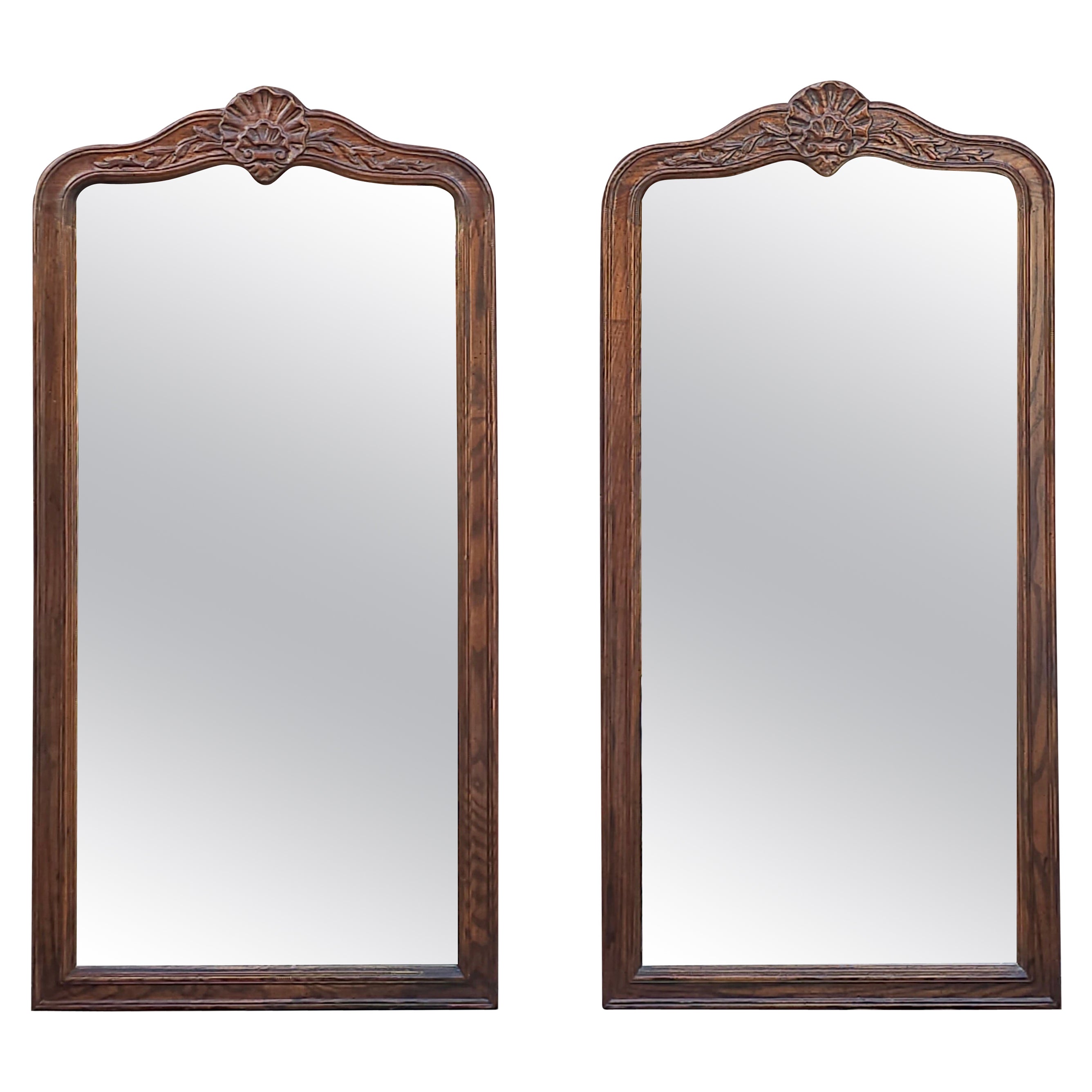Pair of Mid Century Carved and Stained Oak Framed Wall Mirrors