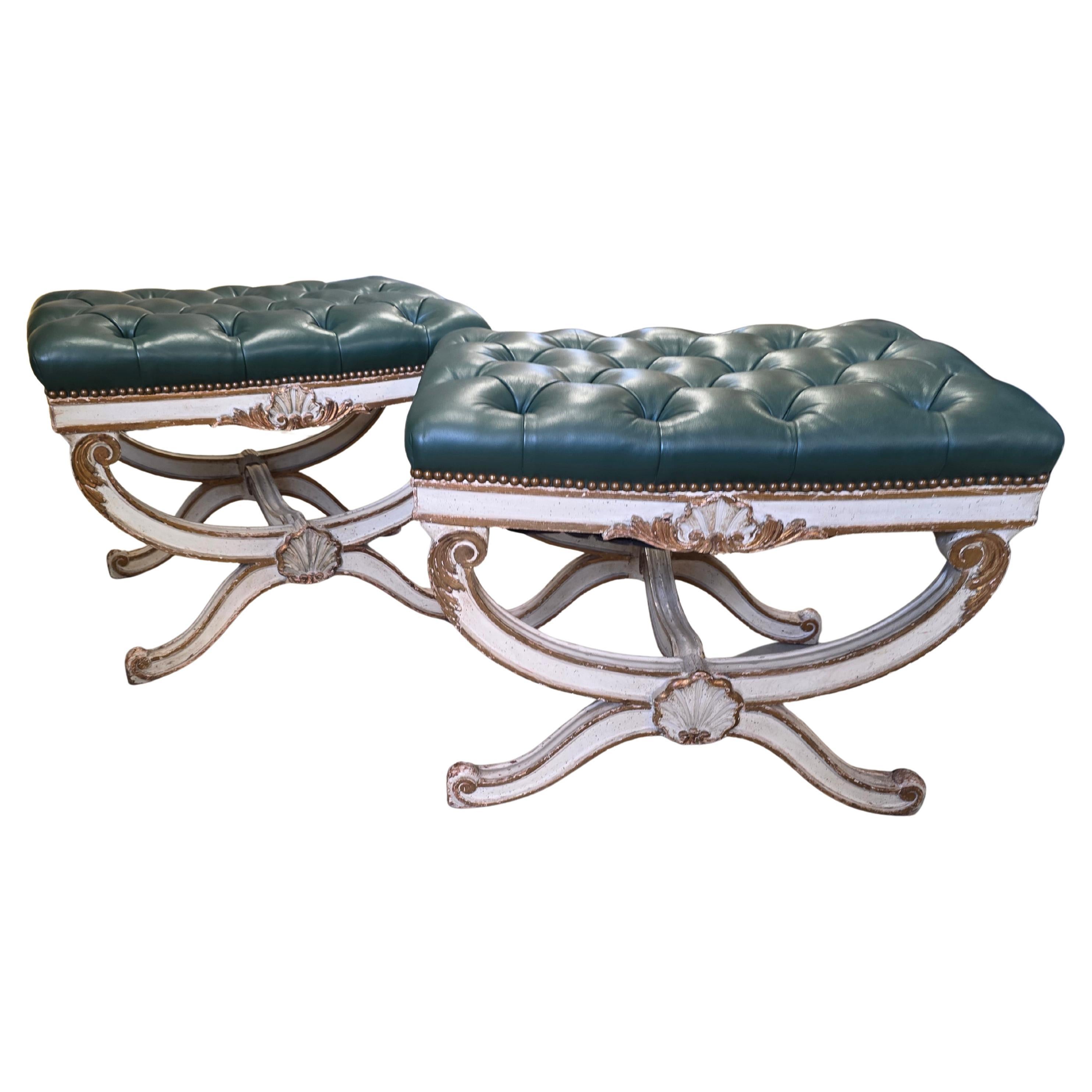 A very handsome and stylish pair, of Italian carved, painted, gilded and upholstered in glove leather curule benches. Excellent quality and a lot of style. Very strong and can be used to sit on. If you require any additional images or information