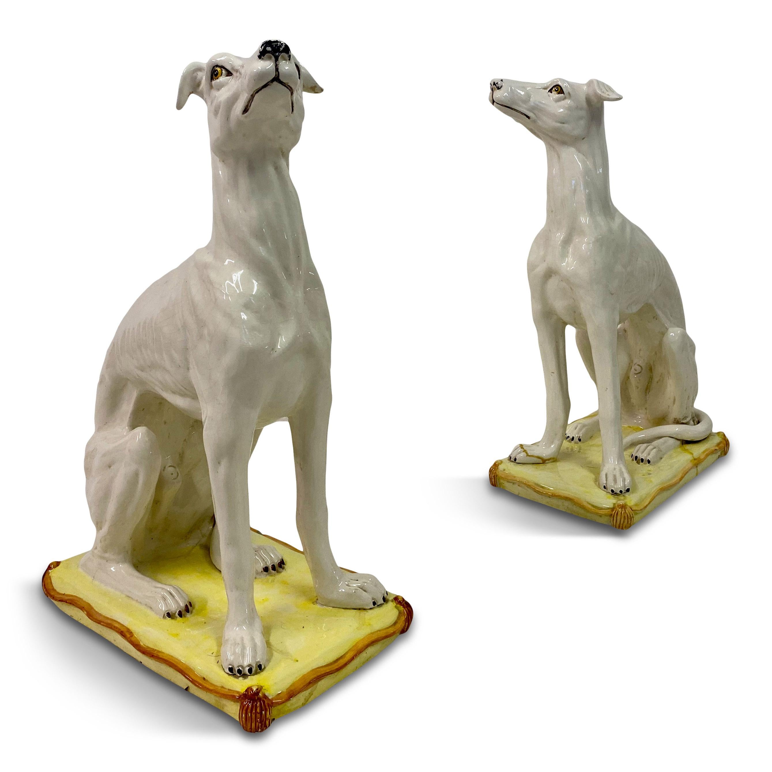 Pair of ceramic whippets

Each siting on a yellow cushion

Handpainted

Wear to the painting and some cracks to the glaze

1950s Italy.
 