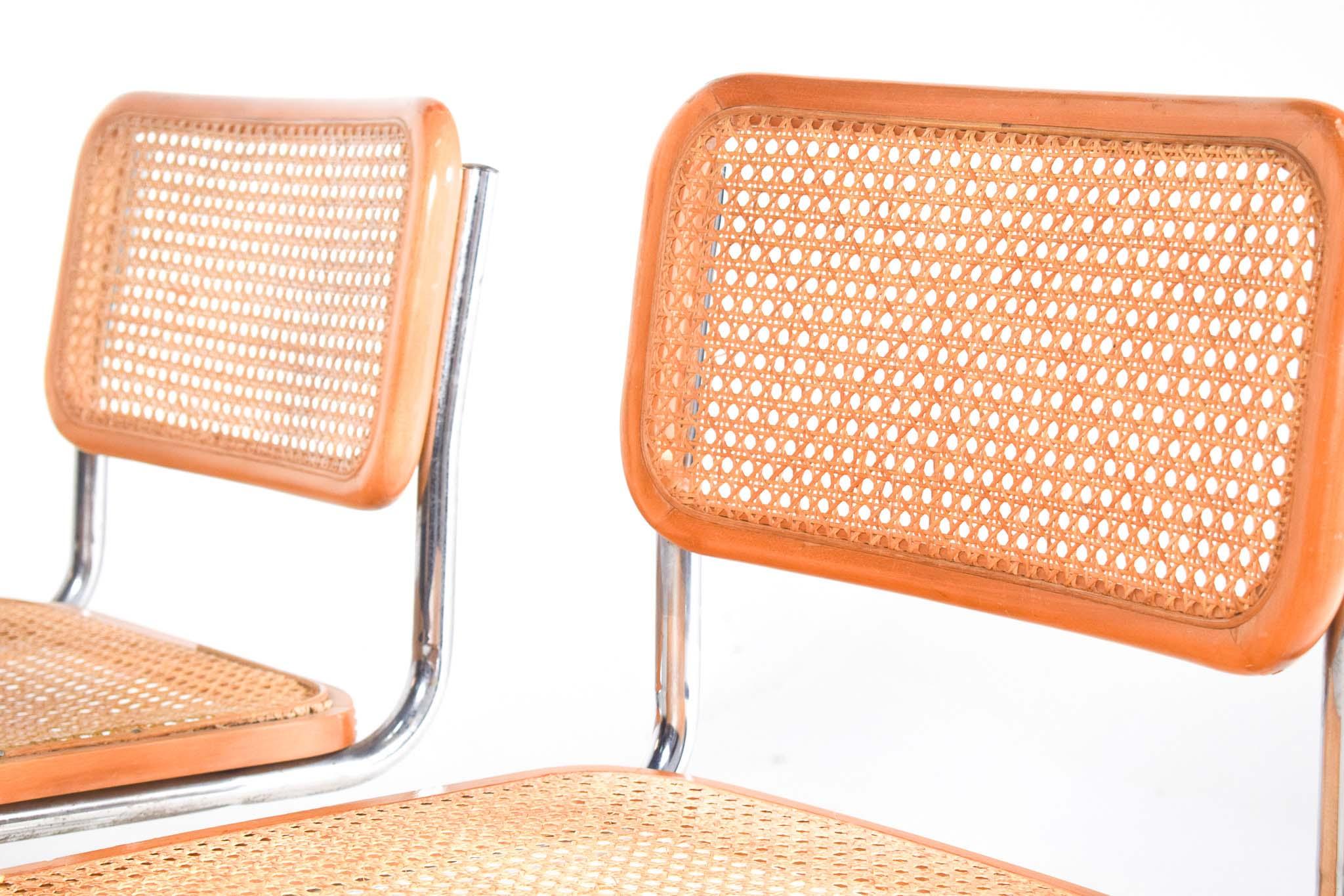 Pair of dining Cesca chairs designed by Marcel Breuer in 1928 and produced since that year till today. Chrome plated tubular frame, seat and back with rattan and frame in natural beech wood make the chair more flexibility and comfort. Cesca was the