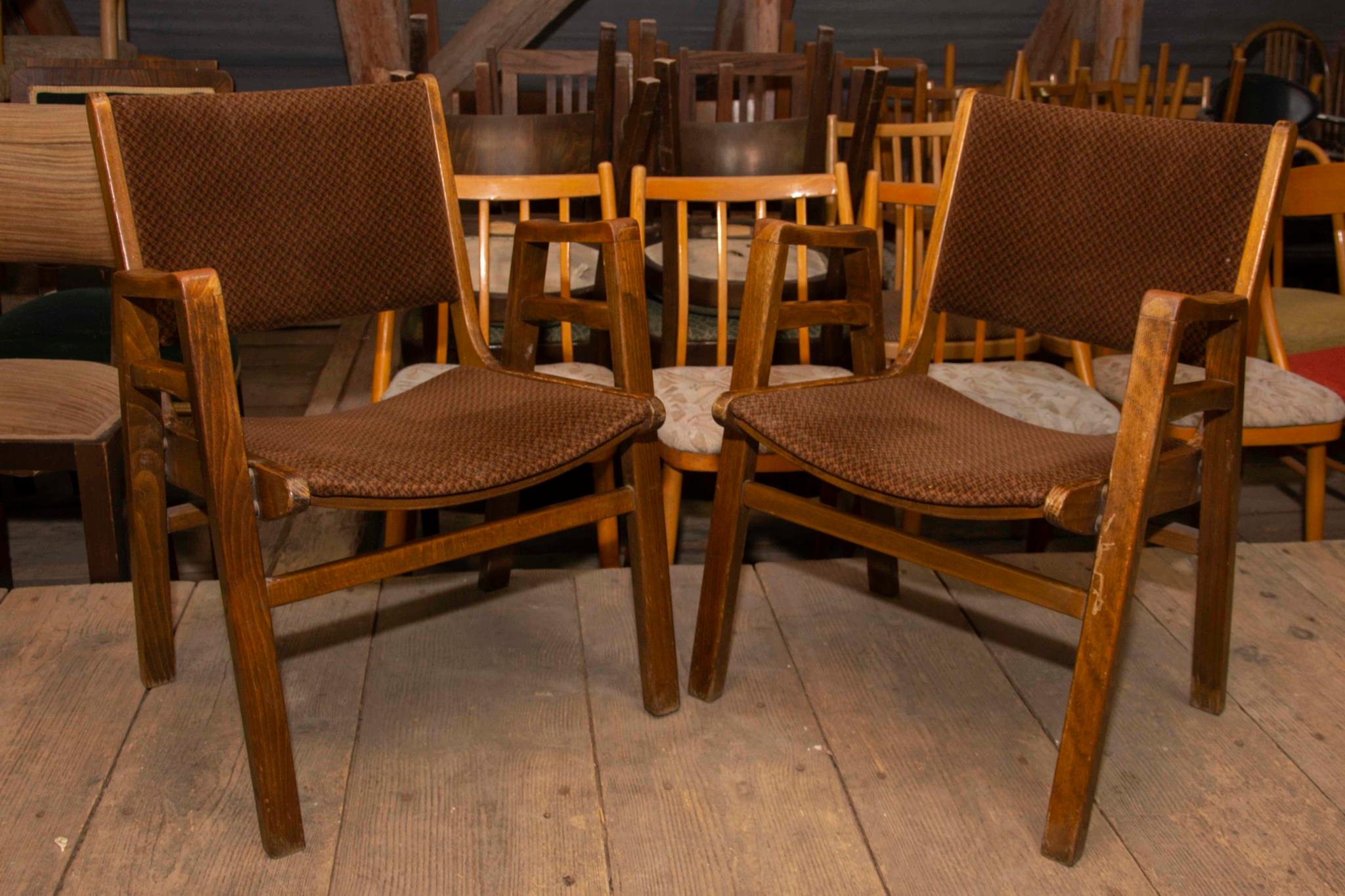 This pair of an interesting vintage chairs was designed by František Jirák. It was made in the former Czechoslovakia in the 1960s. Features an upholstered seats and structure is made of the elm wood. In very good original condition, bears some signs