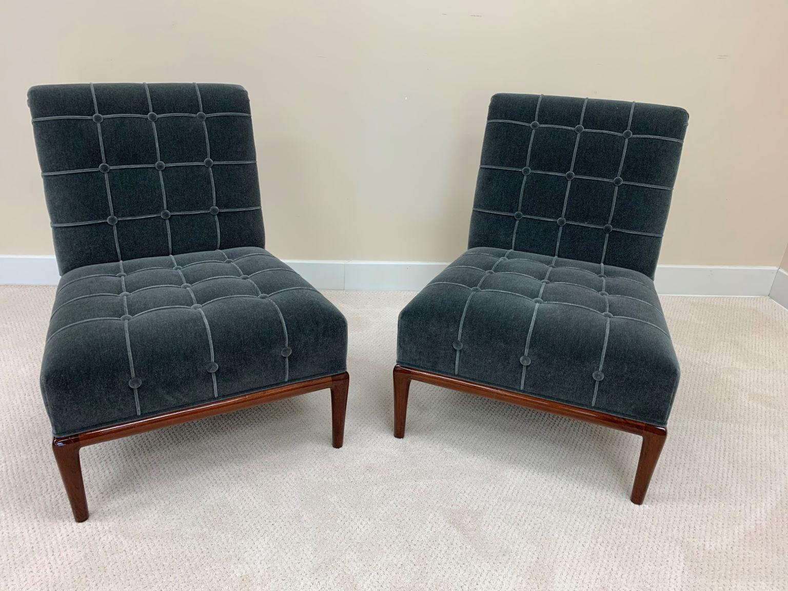 Pair of mid century chairs in the style of T.H. Robsjohn-Gibbings in mohair. Beautiful chairs in a walnut gloss finished, complemented in a soft luxurious gray mohair with a tailored and tuffed look upholstery. Professionally restored. Height 33