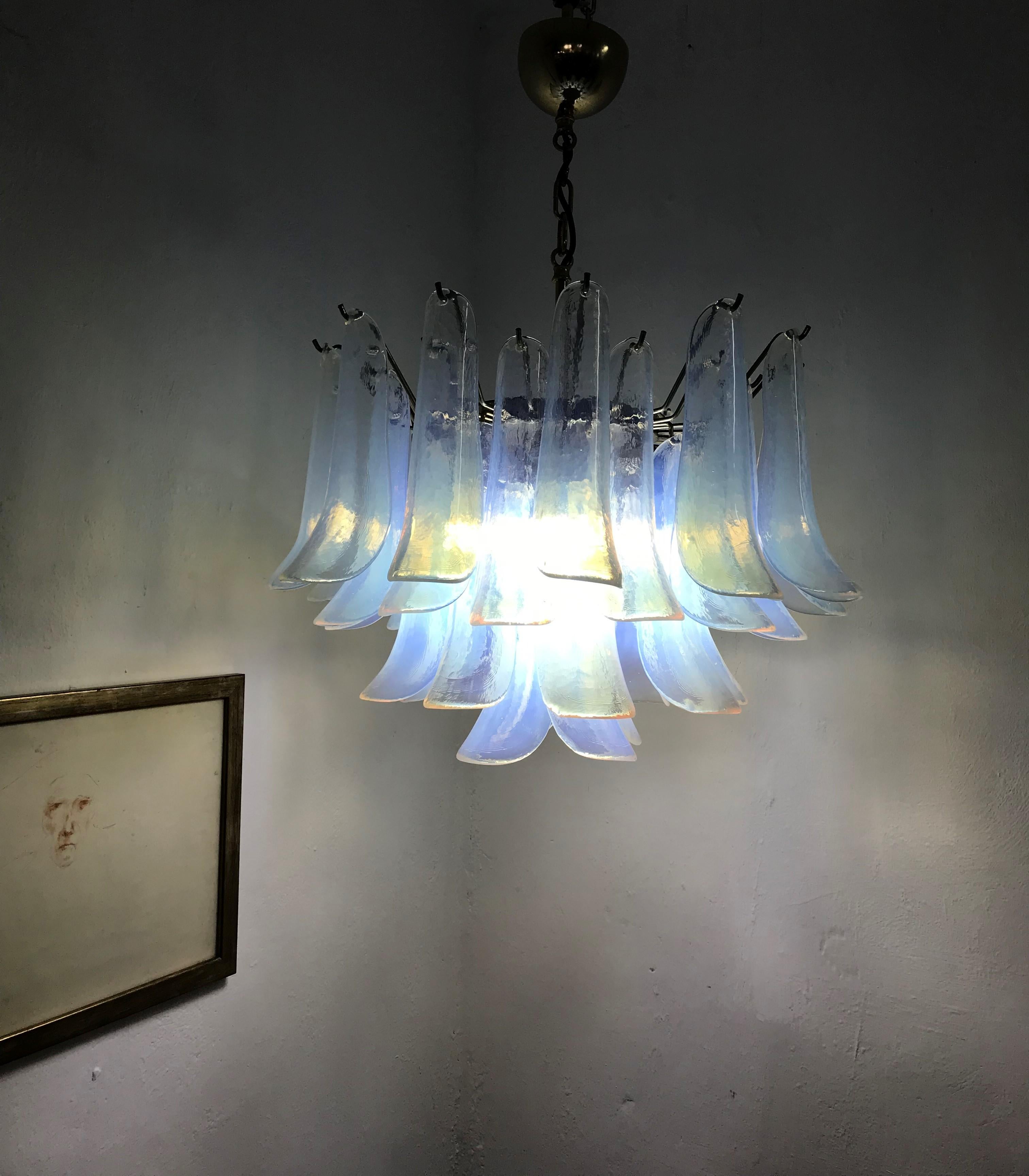 Beautiful pair of five-light chandeliers in opalescent Murano glass by La Murrina, every glass element bears a 