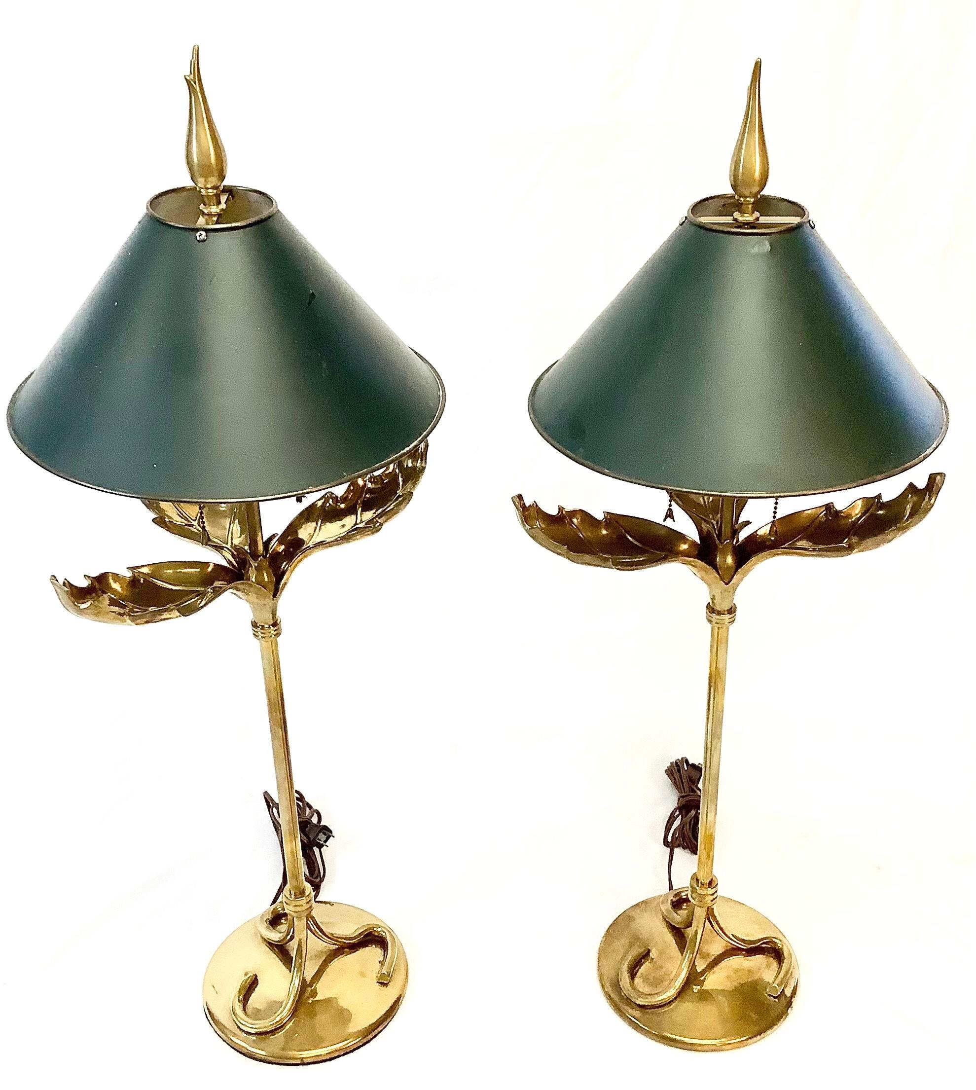 Tan France Auction Pick

Pair of Mid-Century Brass palm leaf lamps with dark green tole shades (shades included). Chapman Manufacturing sticker on bottom. Wired and in working order. Excellent condition with age appropriate wear.

Measures: 35.25