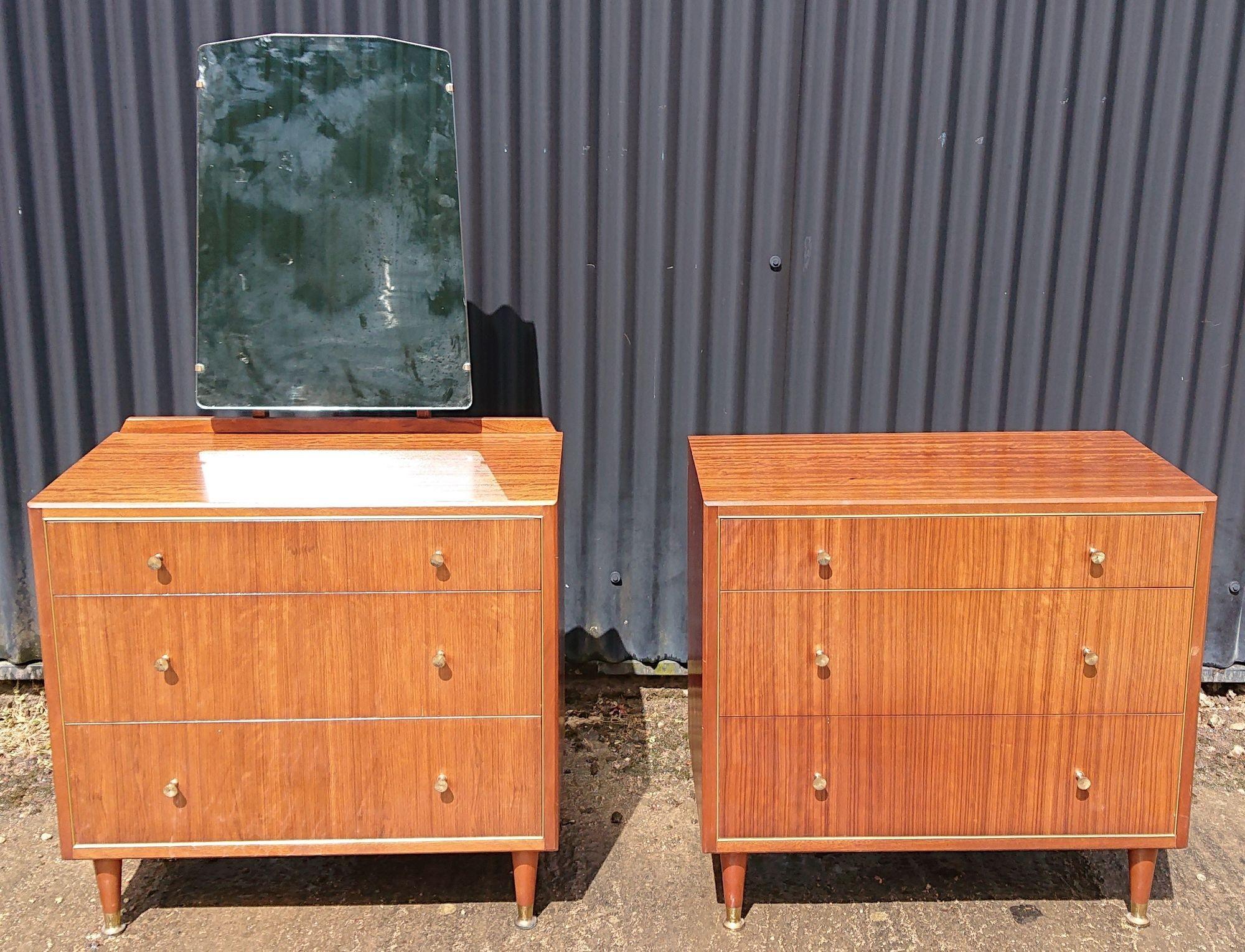Pair of 20th century mid century chests of drawers by Herbert E Gibbs, Cat No 816 Job No 3417. This pair of chests are in great condition with just a small peice of veneer missing to the rear corner of the top of one of them. The mirror and raised