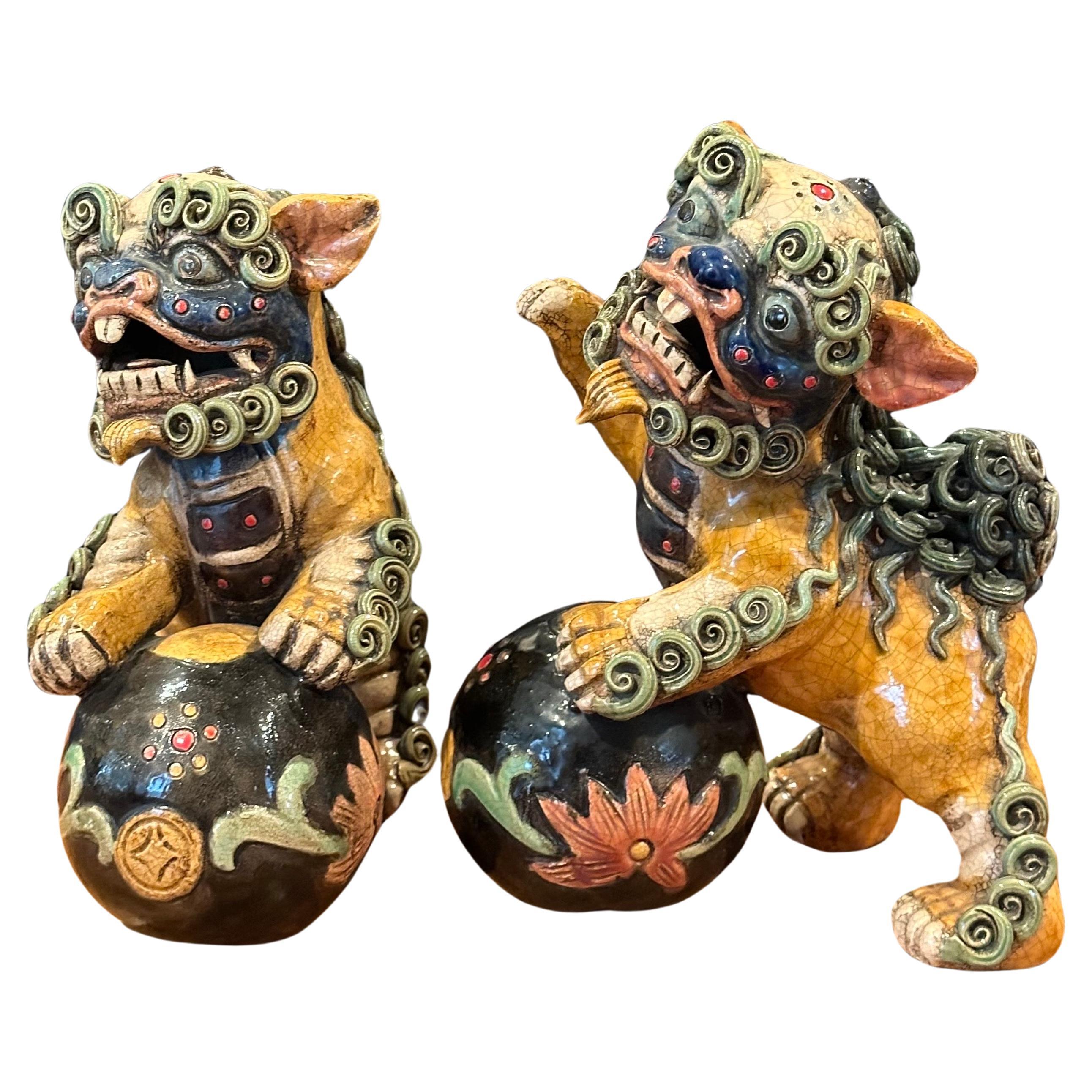 Mid-Century Modern Pair of Mid-Century Chinese Ceramic Polychrome Foo Dogs For Sale