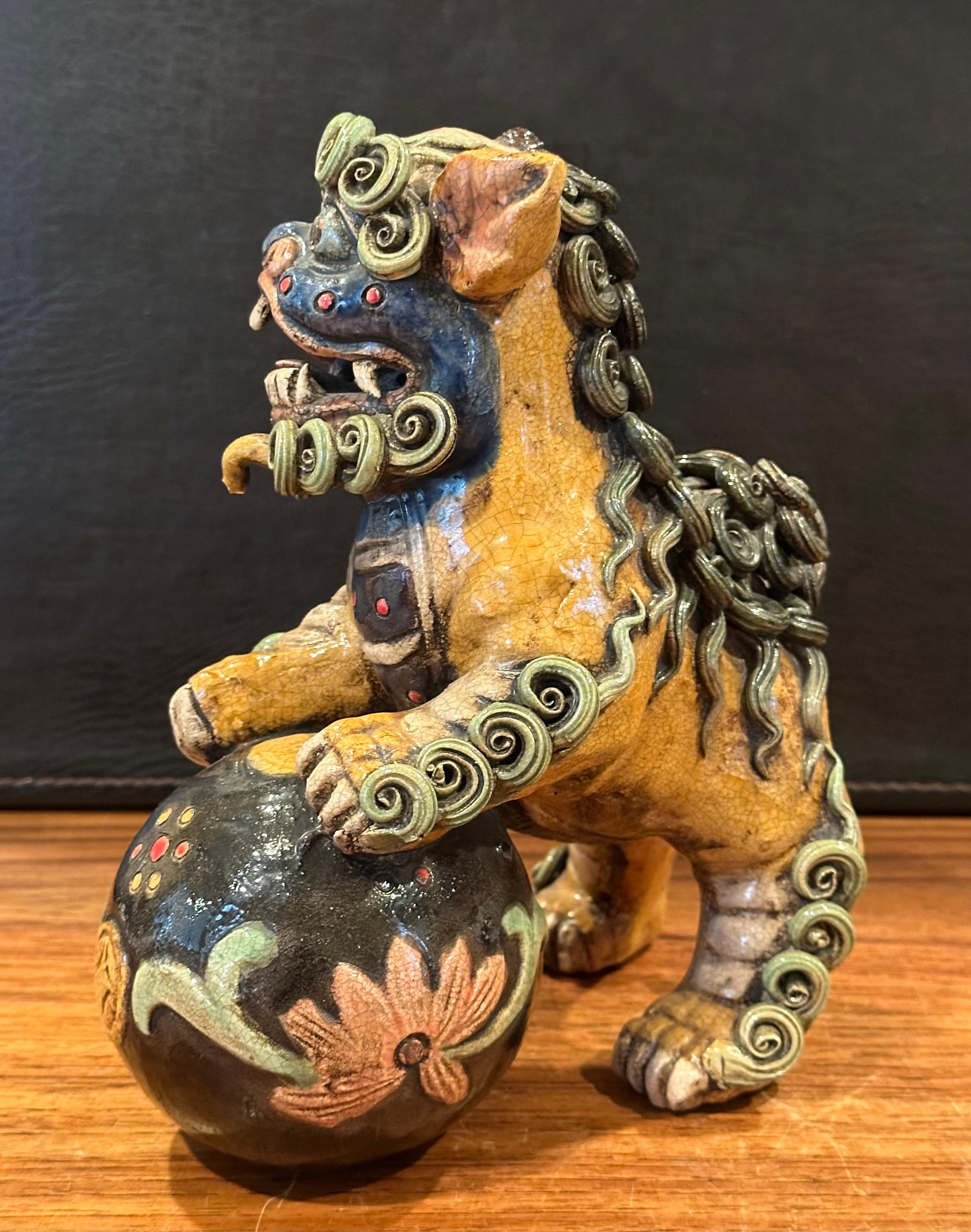 20th Century Pair of Mid-Century Chinese Ceramic Polychrome Foo Dogs For Sale