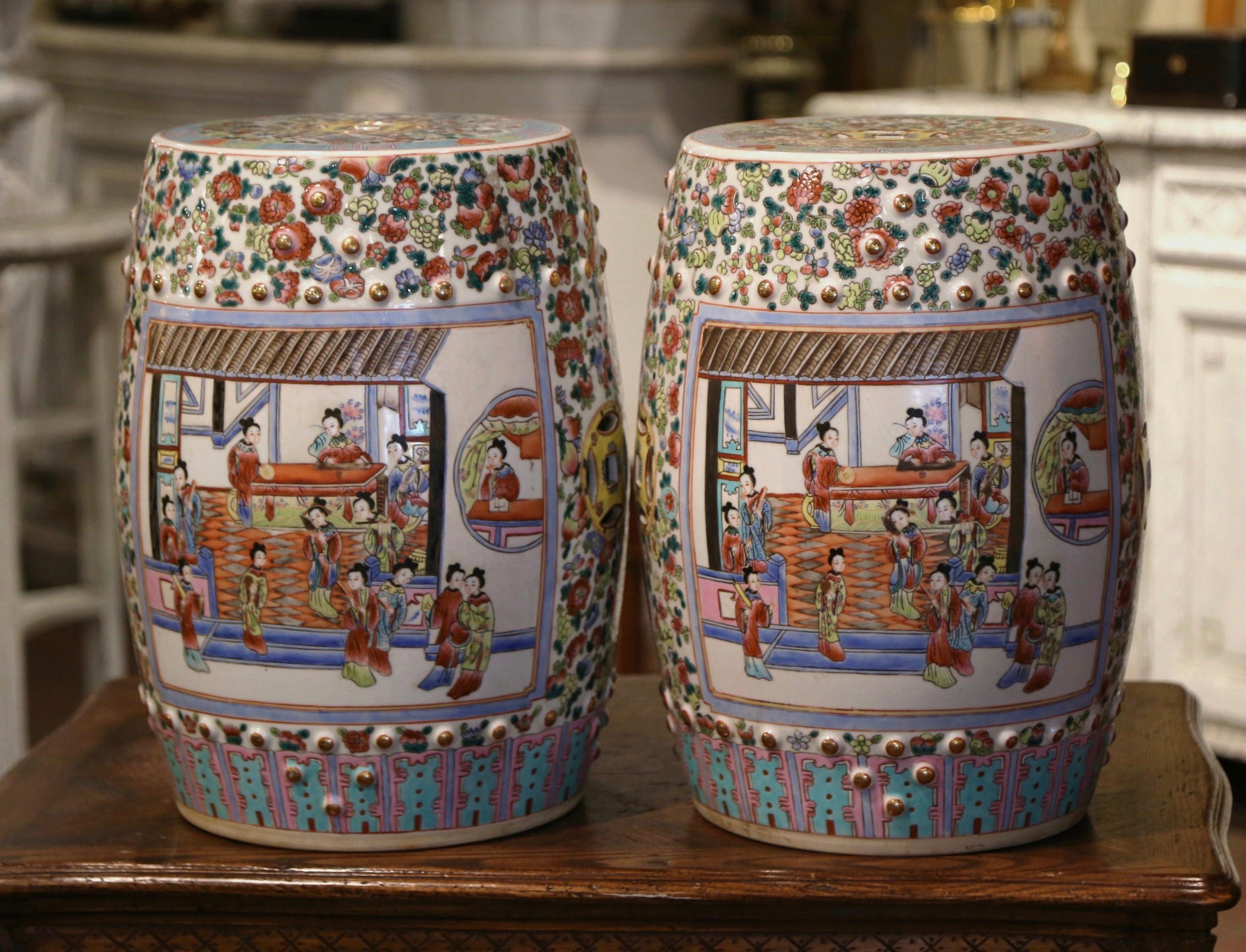 Decorate a den or a living room with this pair of colorful polychrome garden stools. Created in China, circa 1960 and round in shape, the porcelain seats are pierced on the top and around the perimeter for an intricate, sculptural effect. They are