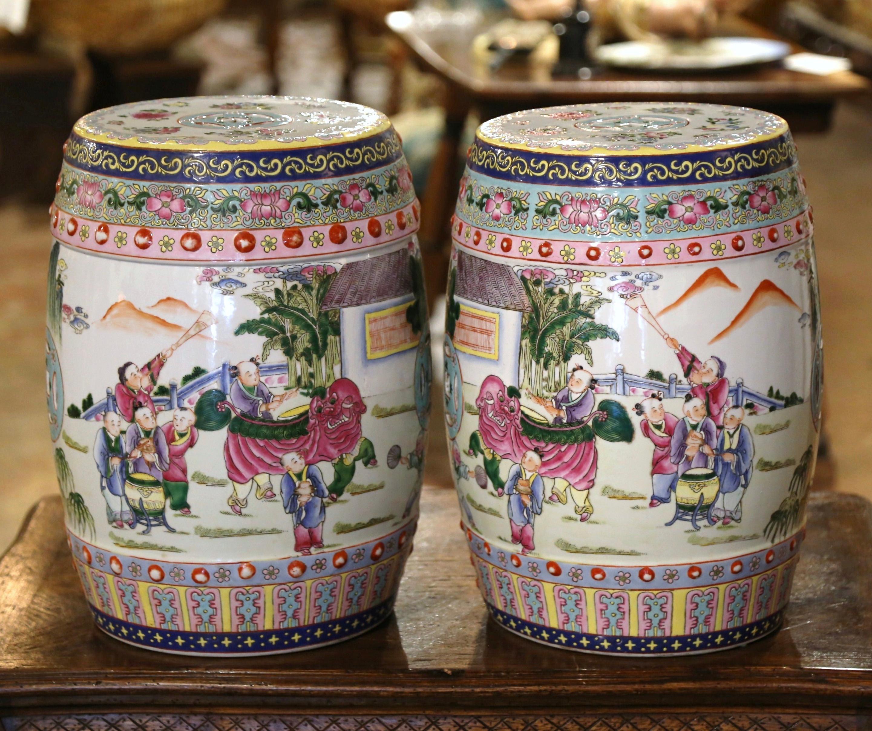 Decorate a den or a living room with this pair of colorful polychrome garden stools. Created in China, circa 1970 and round in shape, the vintage porcelain seats are pierced on the top and around the perimeter for an intricate, sculptural effect.