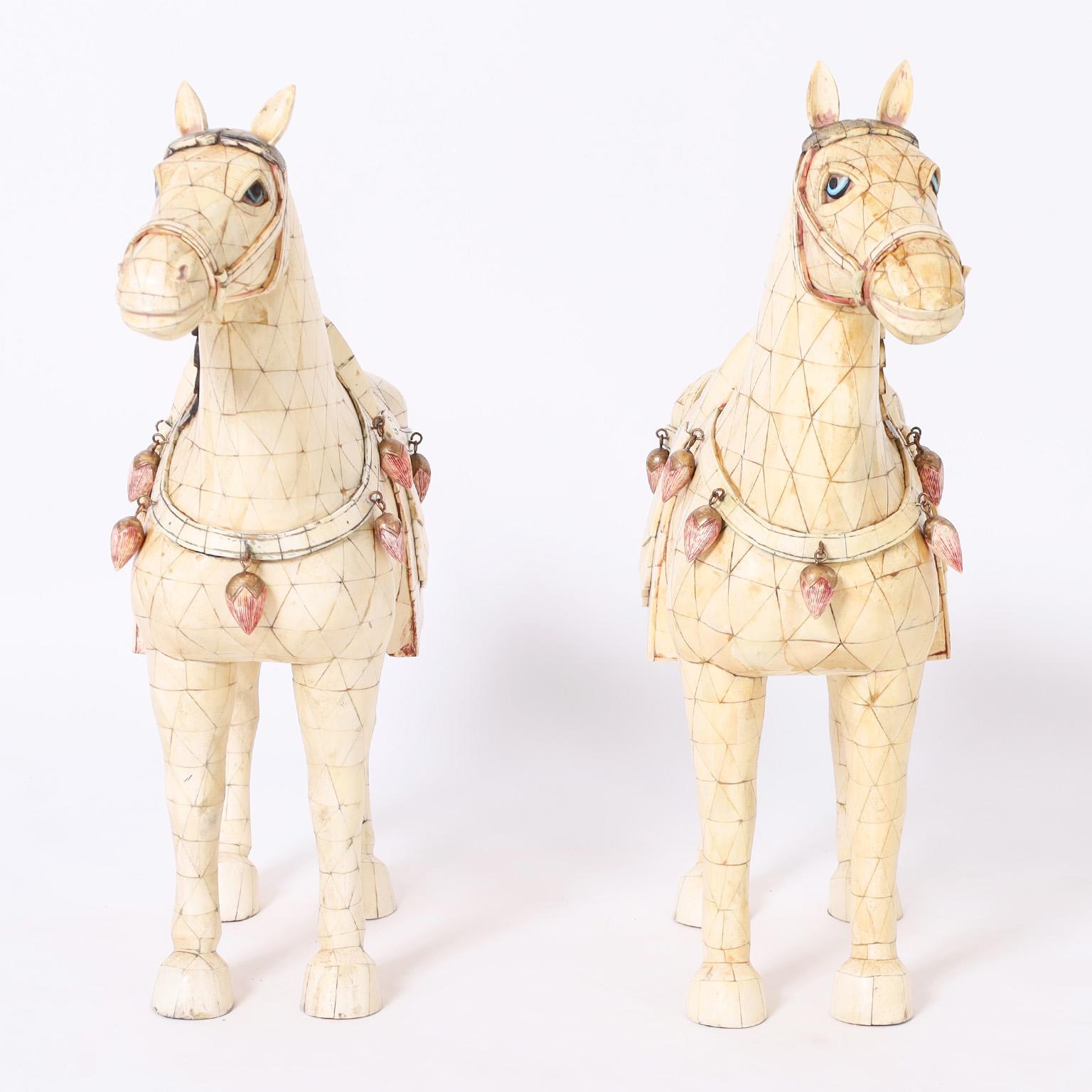 With a reference to the Tang Dynasty an impressive pair of Chinese horses, hand crafted in a tessellated technique with carved bone as a symbol of wealth, longevity and wisdom.