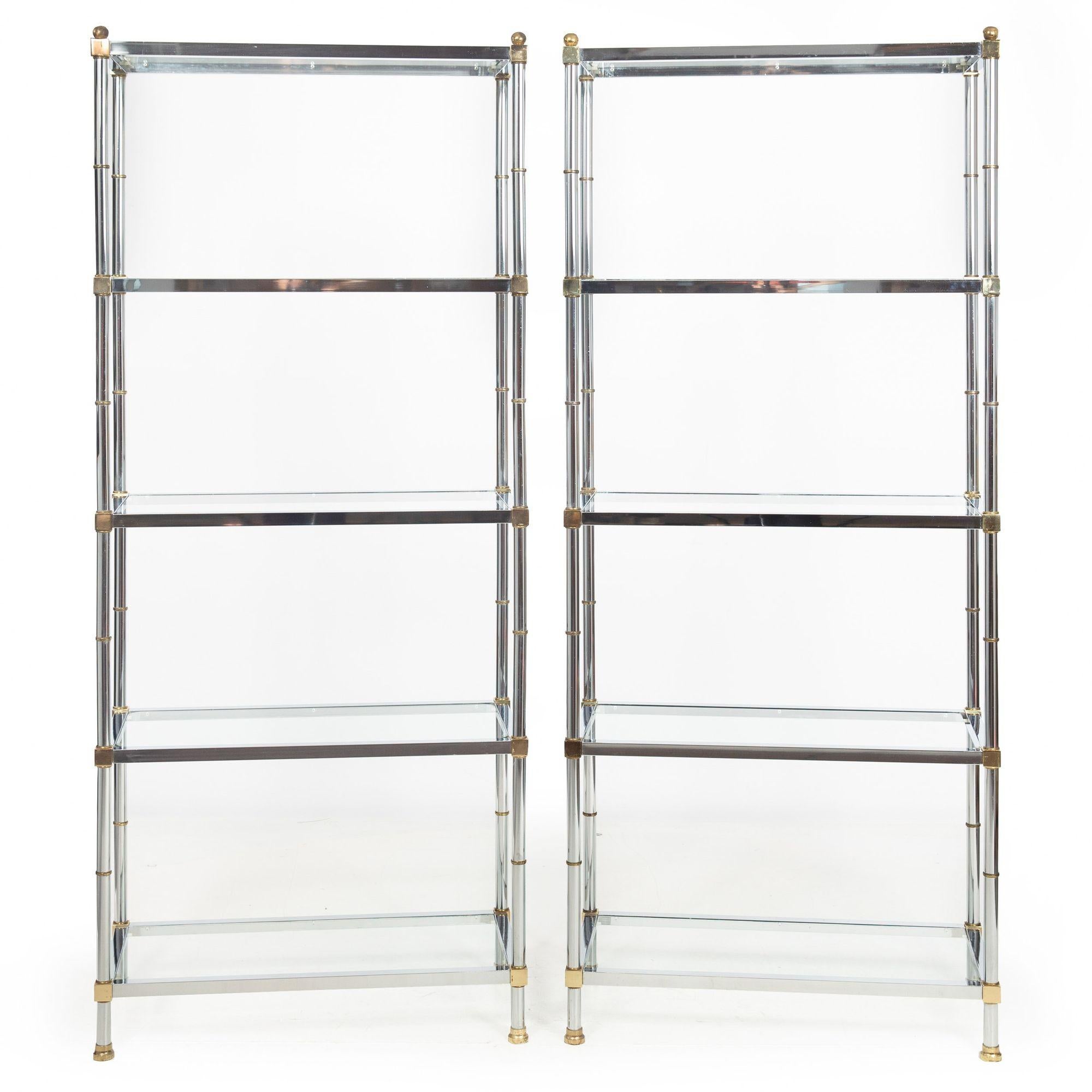 PAIR OF MID-CENTURY CHROME, BRASS AND GLASS ETAGERE BOOKSHELVES
In the manner of Maison Jansen, circa mid 20th century
Item # 904SAN13A

A nice modernist pair of chromed steel and brass open bookshelves with five-shelves on each, it features brass