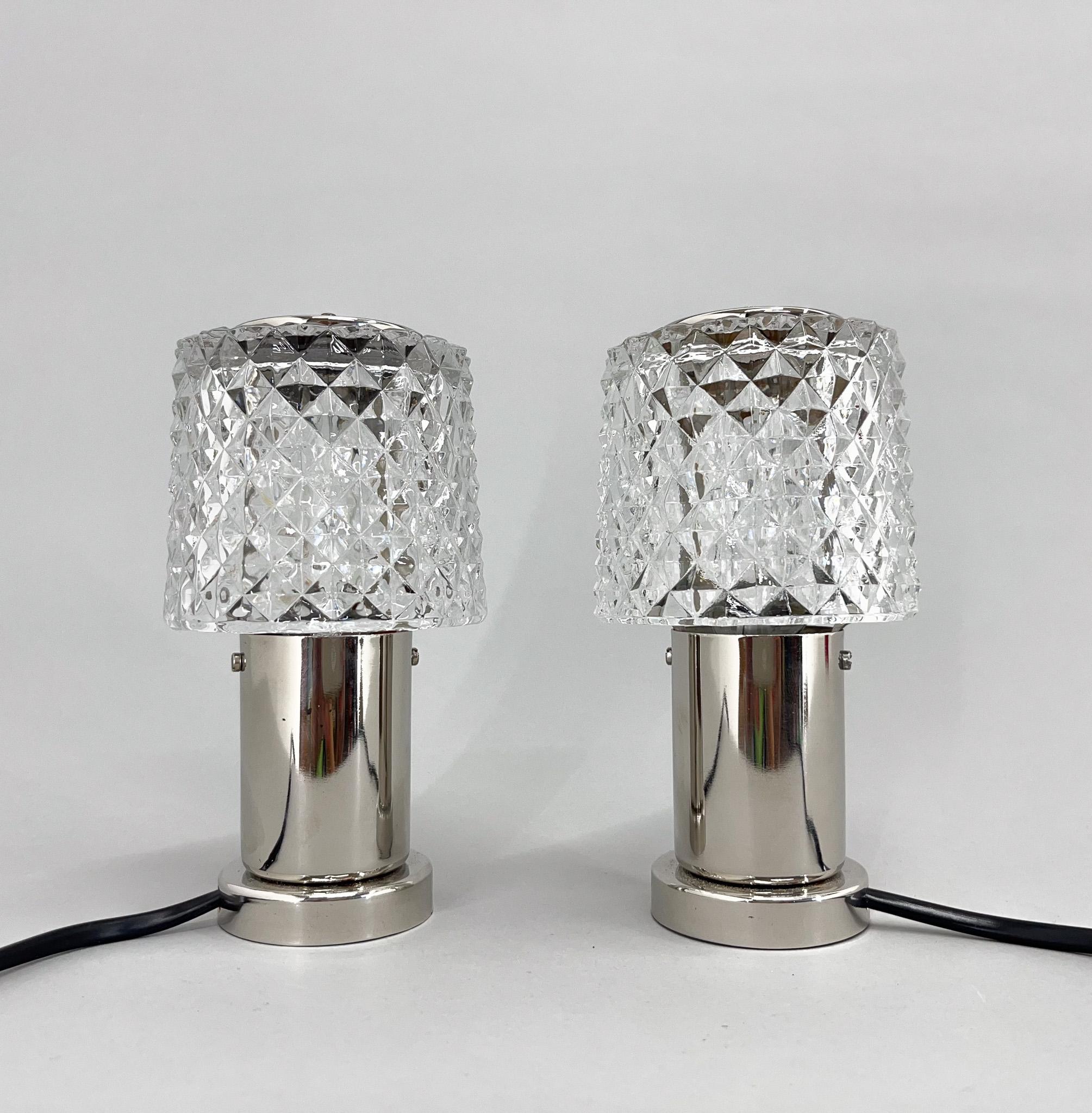 Set of two small table or bedside lamps by famous Kamenicky Senov Glassworks. Produced in former Czechoslovakia in the 1960's.The lamps were restored and rewired. There are four pairs available. Bulb: 2x1 E14-E15 bulbs. US plug adapter included.