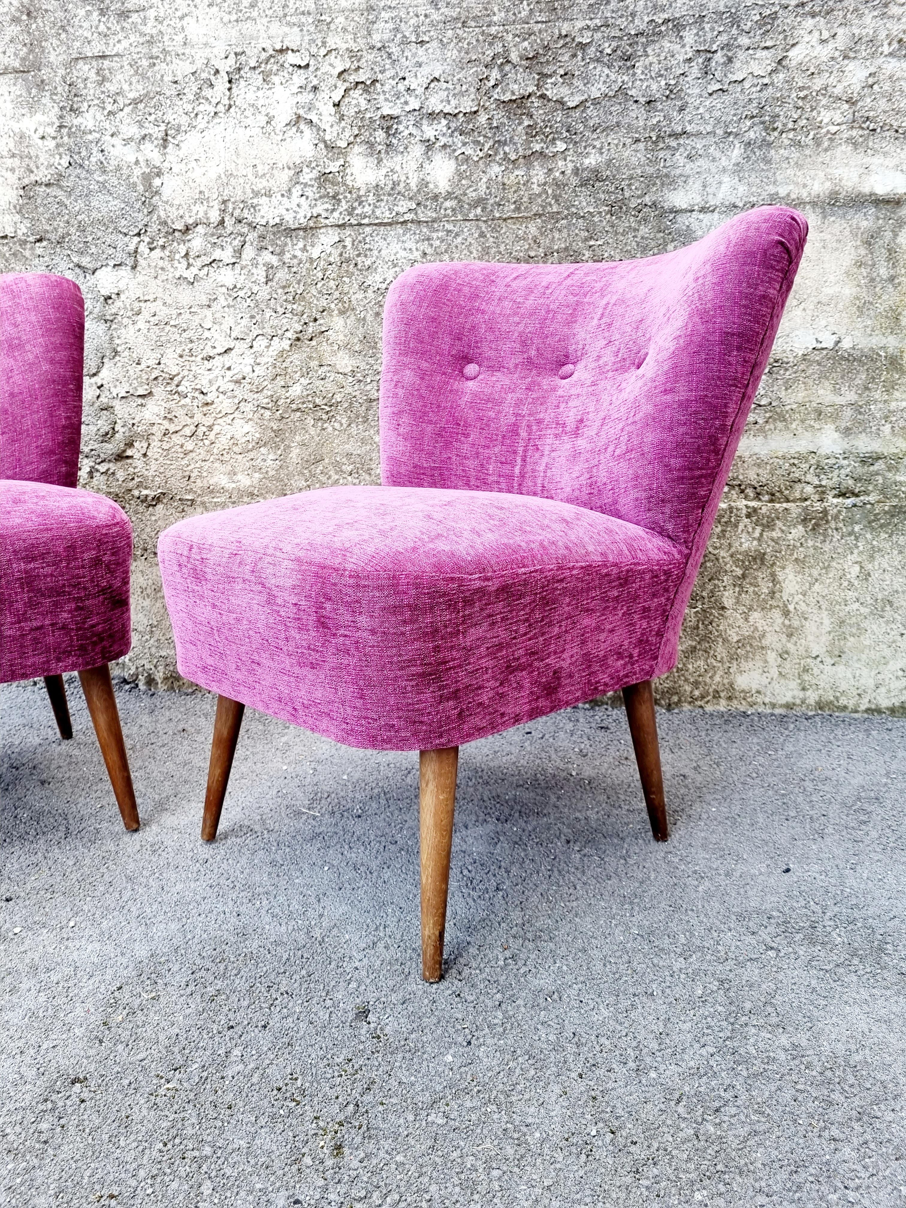 Mid-Century Modern Cocktail Chairs were made in '60s, Scandinavian design.
These beautiful chairs will create a charming vintage atmosphere in any room of your home. Very retro and beautiful piece.

Chairs have new purple fabric. They are