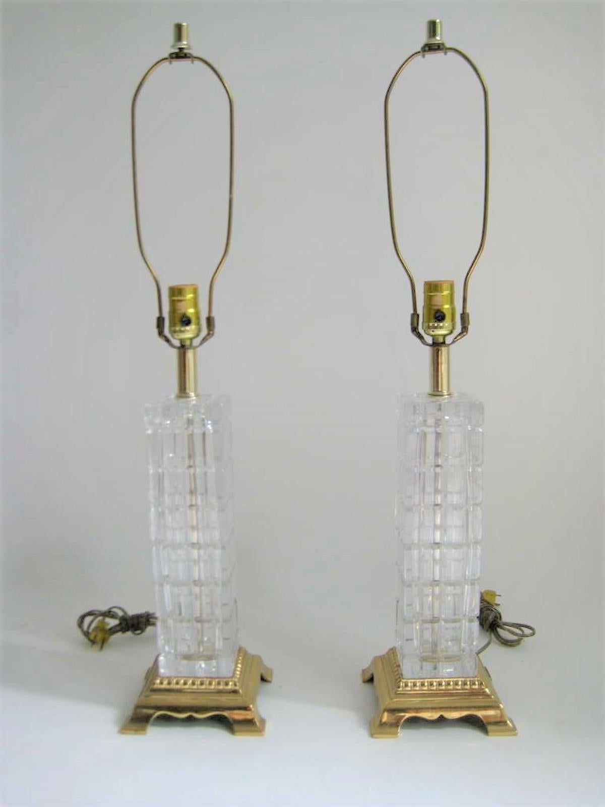 Elegant Pair of Glass and Brass Table Lamps. Sturdy/ Heavy in weight. Solid Brass Bottom Base. Excellent condition. 
Height of base only - from bottom to harp is 15 inches. 
Height including harp is 27.5 inches