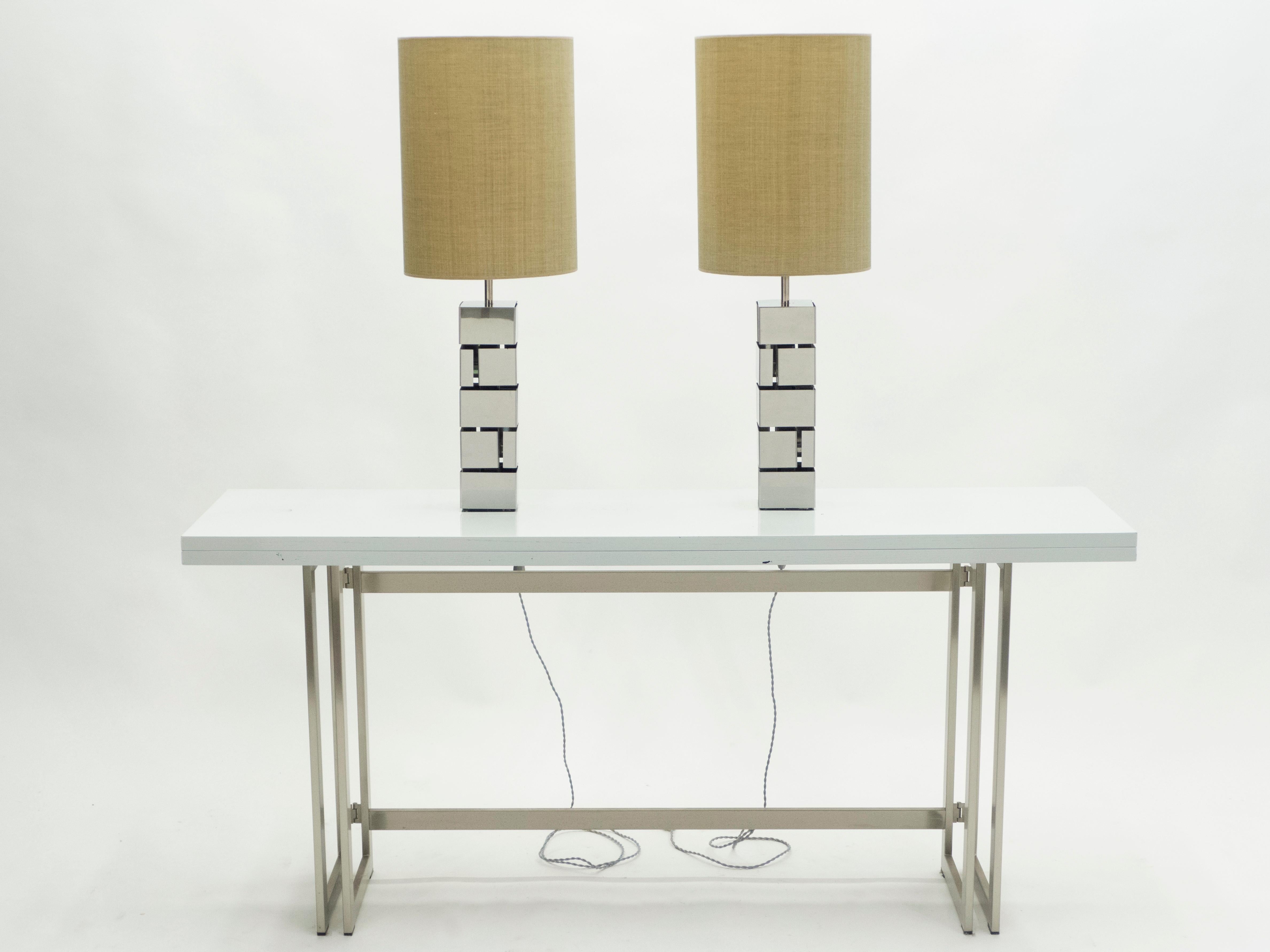 This pair of lamps is typical of designer Curtis Jere’s midcentury metal. A rich and architectural chrome structure with beautifully textured custom made lampshades feels serious and sophisticated. Their minimal design and trendy coloring makes them
