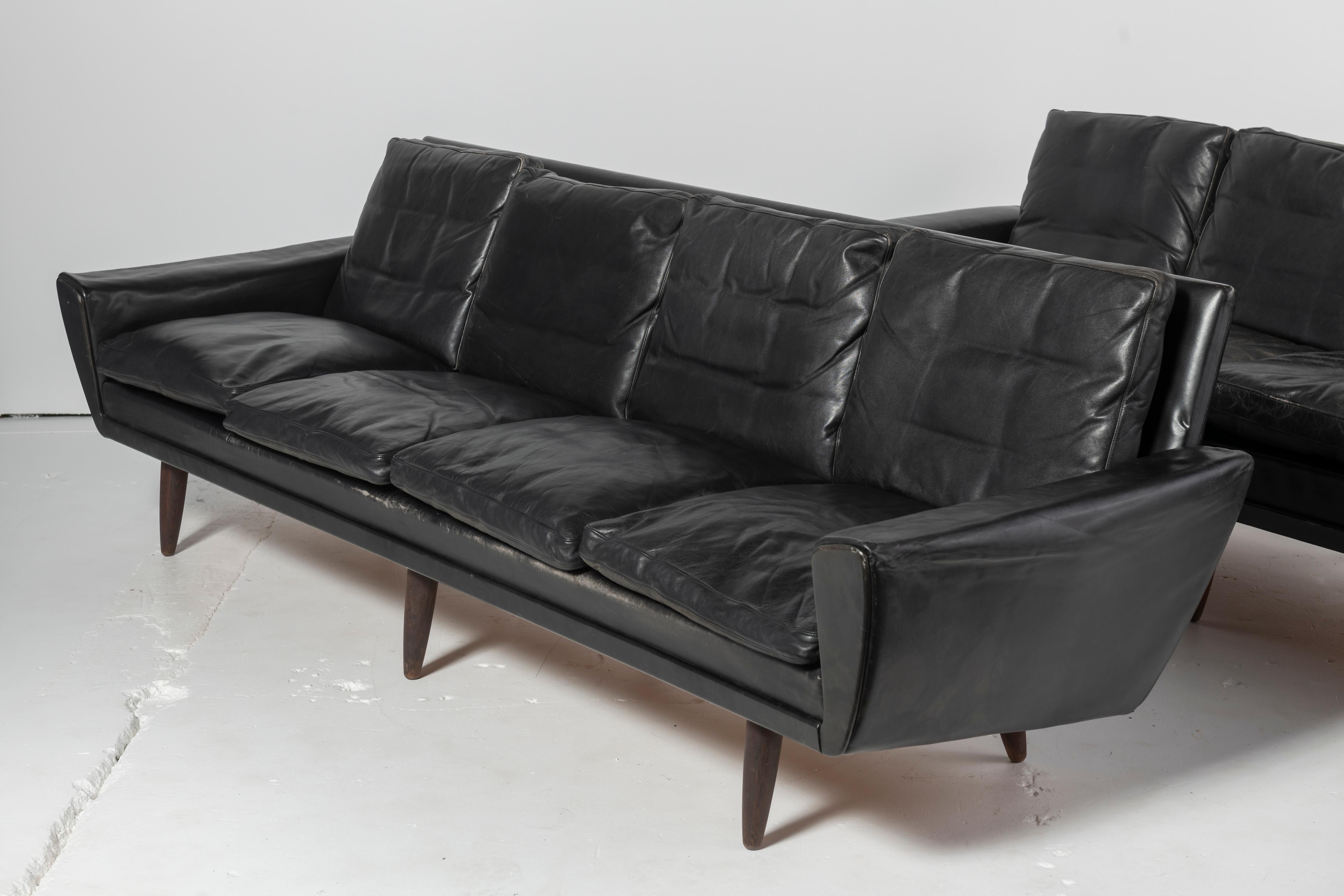 Extra long Danish sofas with original leather upholstery that are very comfortable. One of the sofas has a different cushion from the other 8, though it appears to be a close match. 


 