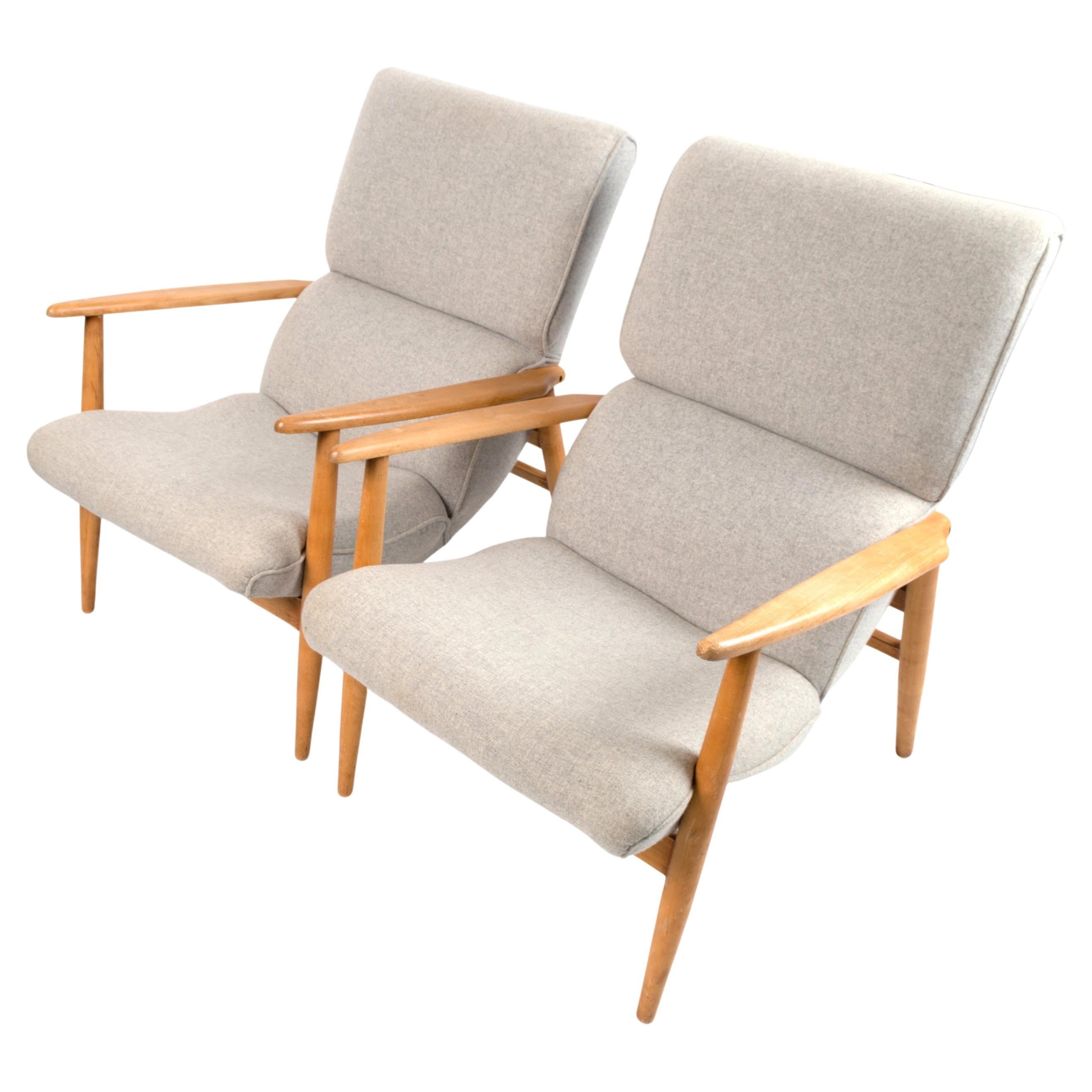 A pair of mid-century Danish lounge chairs armchairs C.1960.
Constructed in a beech frame and upholstered in a classic mid-century grey wool fabric.
In excellent condition commensurate of age.