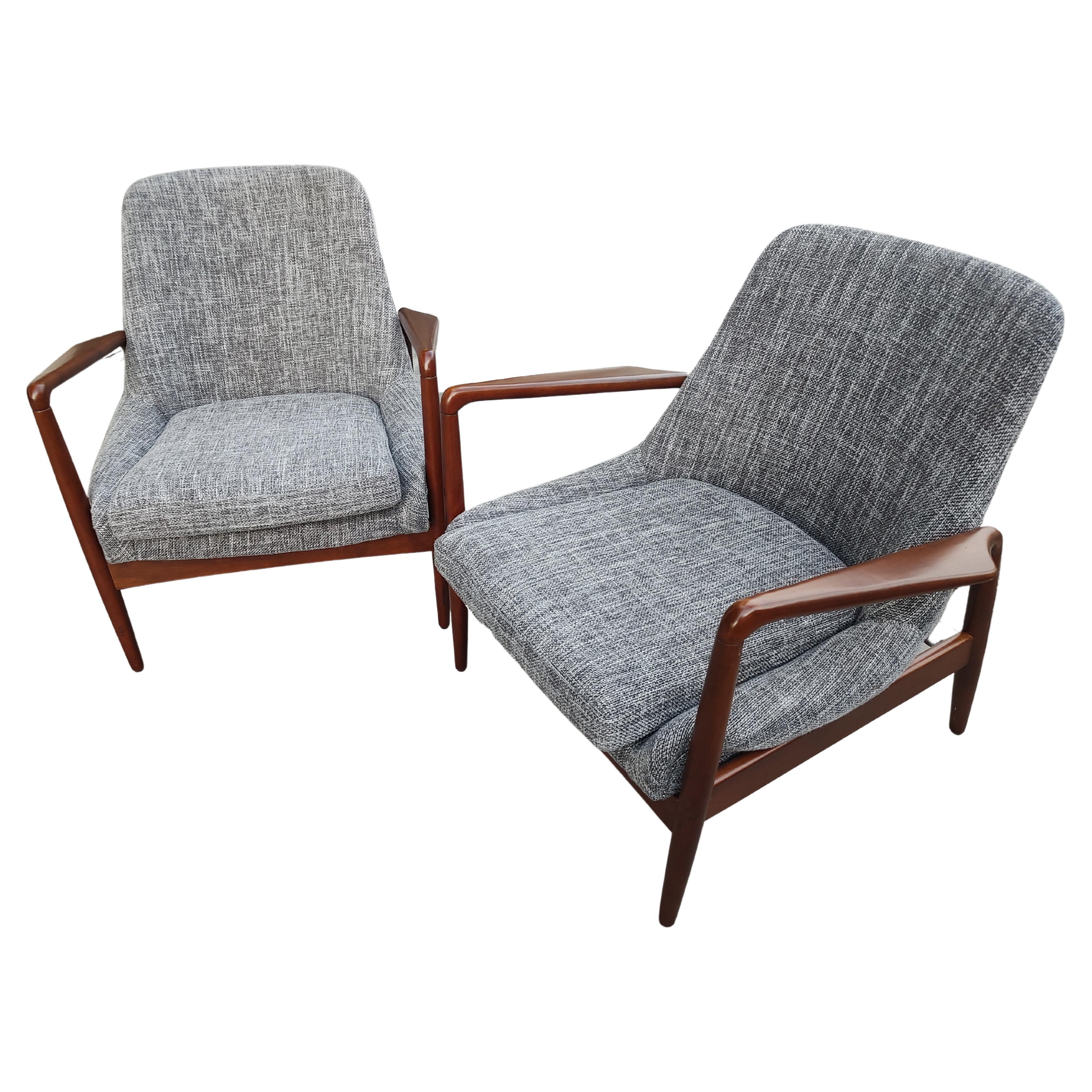 Fantastic pair of Mid Century Modern lounge chairs in a fab fabric reminiscing the fifties. Beautiful color in a tweed fabric. Sculptural arms with great lines on these chairs
 Some nicks to the finish on front legs which we will have corrected, see