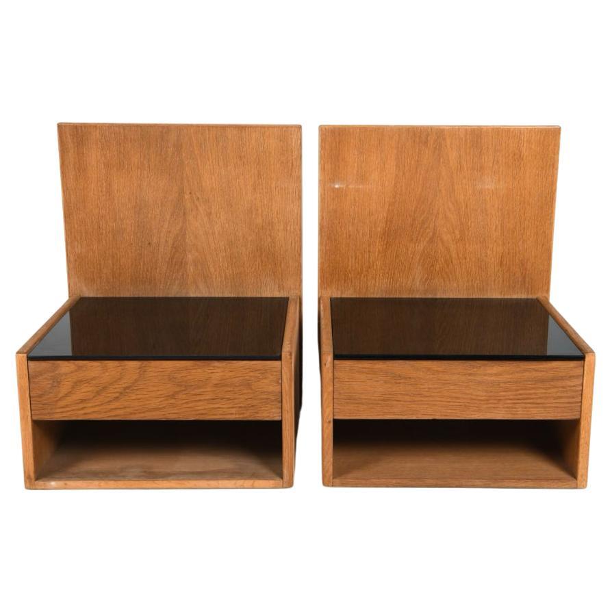 Pair of Mid century danish modern oak nightstands by Hans Wegner by Getama. Floating oak nightstands with glass inserts to top. Made in Denmark. Stamped Getama on bottom. Located in Brooklyn NYC.

Made to mount on wall or headboard.

Sold as a pair