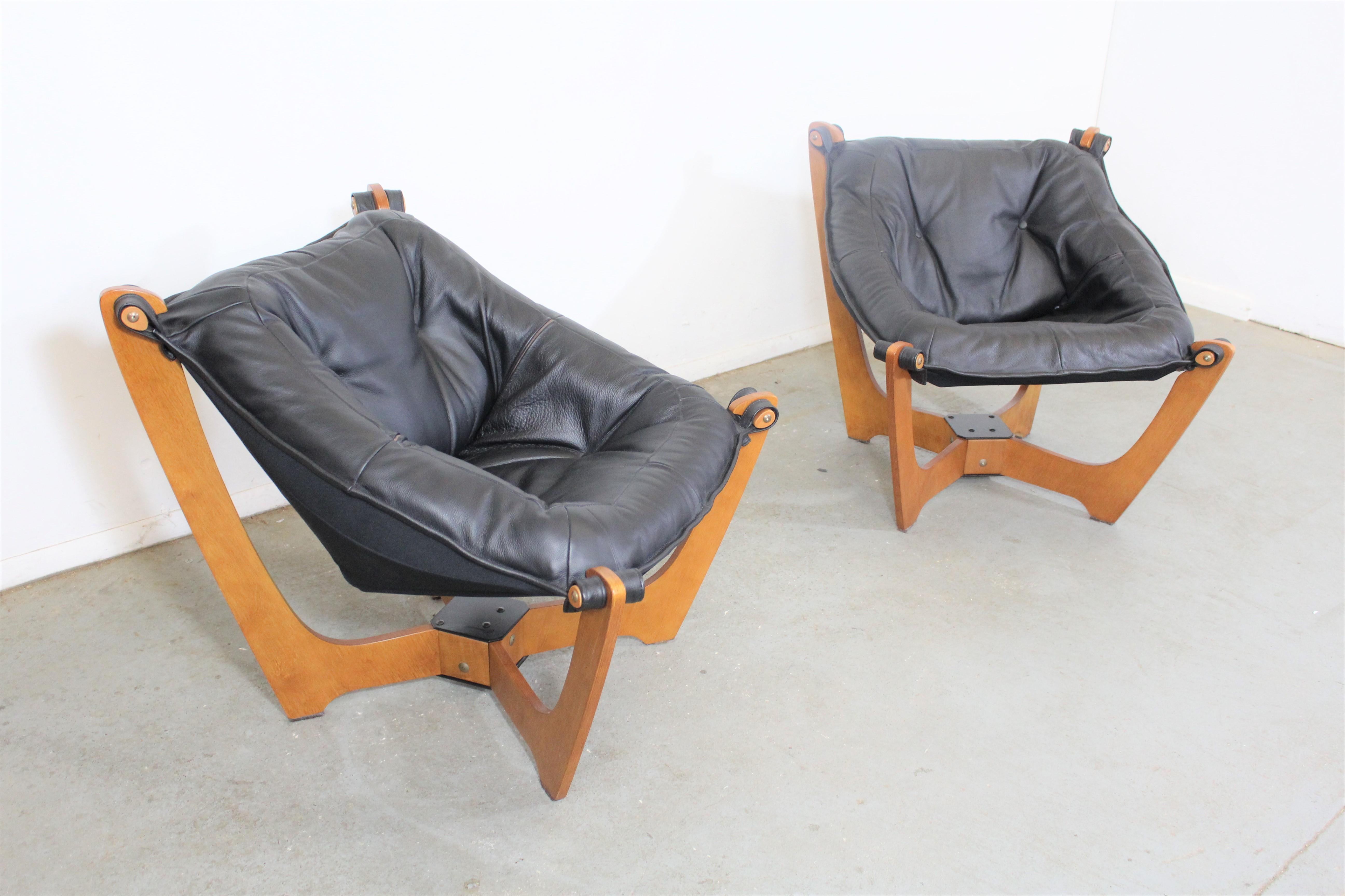 Pair of midcentury Danish modern odd Knutsen lounge chairs

Offered is a pair of vintage midcentury Danish modern lounge chairs. These Luna low back leather lounge chairs are made by Norwegian designer Odd Knutsen. They will provide character and