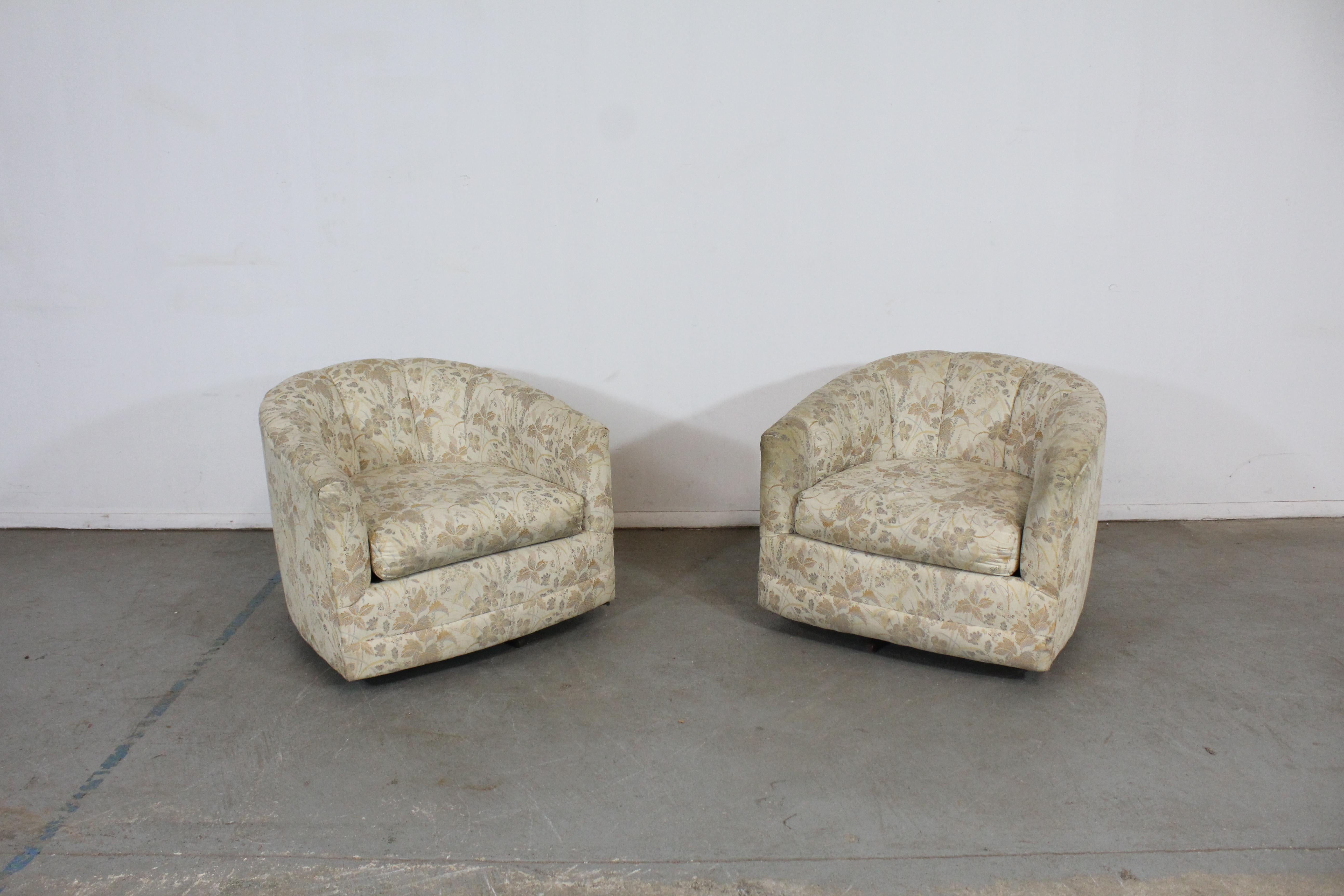 Pair of Mid-Century Modern Barrel back swivel club chairs

Offered is a pair of vintage Mid-Century Modern style swivel chairs. These chairs have round backs and metal bases. We're unsure of their exact age, but we estimate mid-late 20th century.