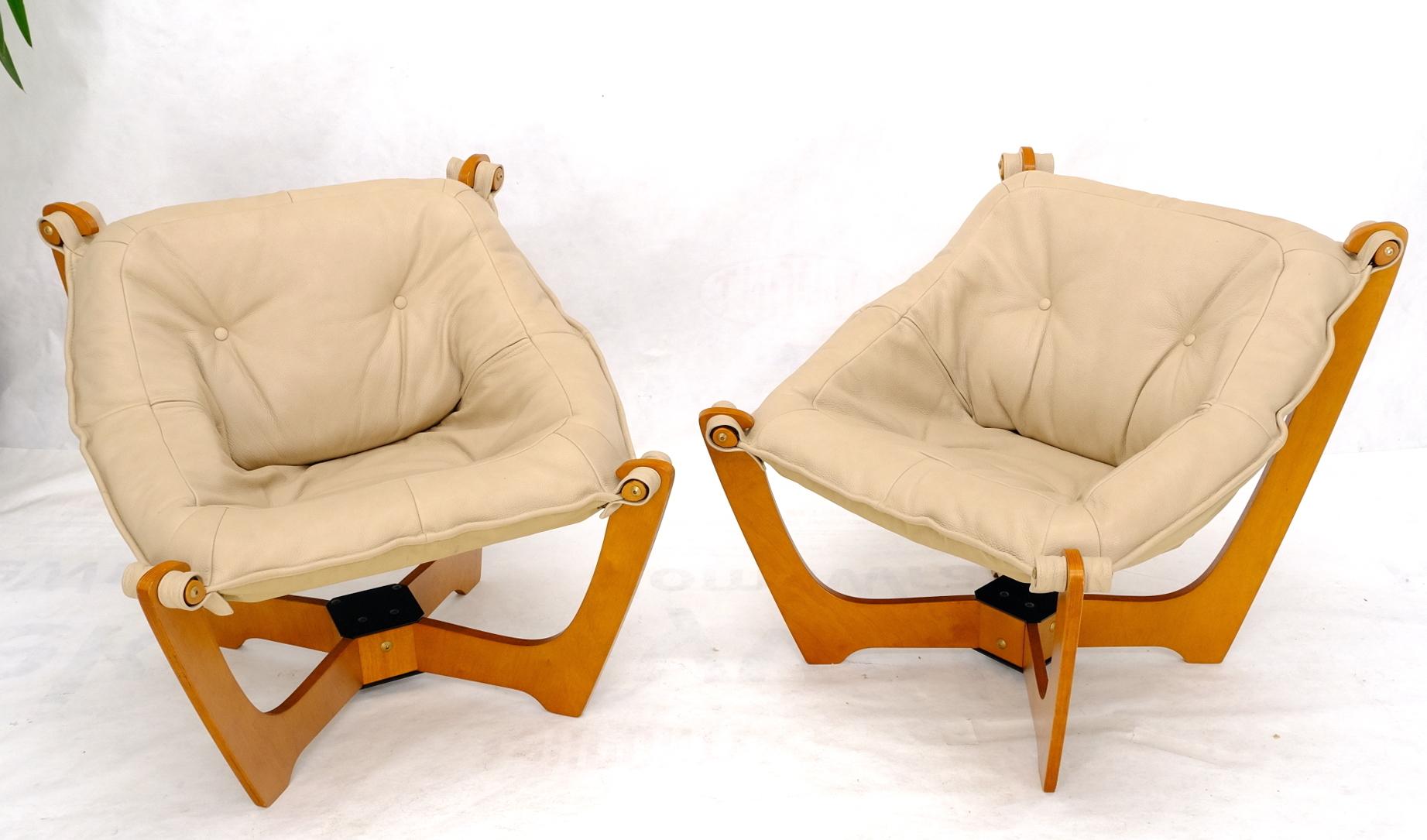 Pair of Danish modern beige sling upholstery lounge chairs. Very comfortable sling seats.