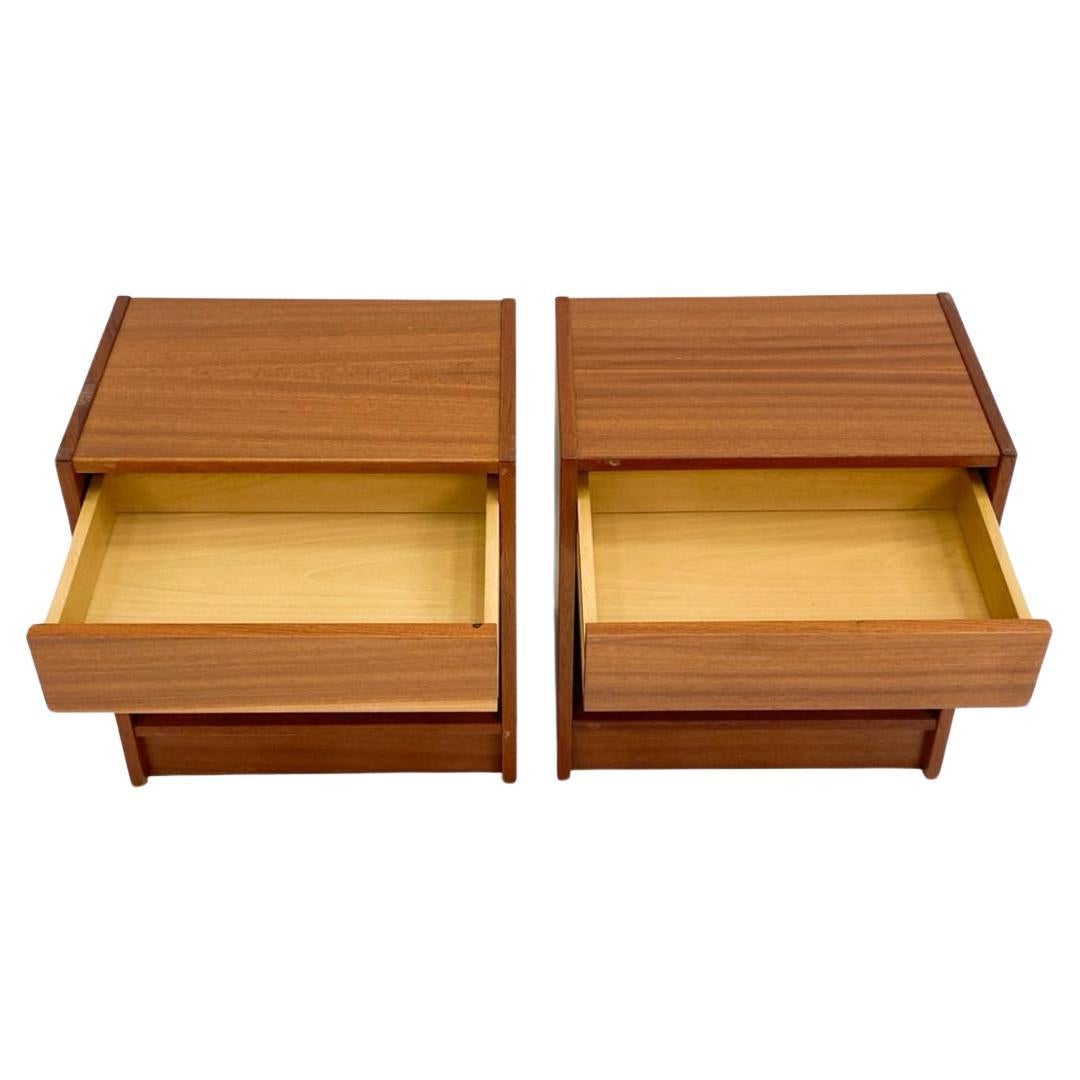 Beautiful pair of petite mid-century Danish modern teak single-drawer nightstands. Great simple design and great vintage condition - clean inside and out. Drawers slide smooth and with open space below drawer. Great dark teak wood grain. Made in