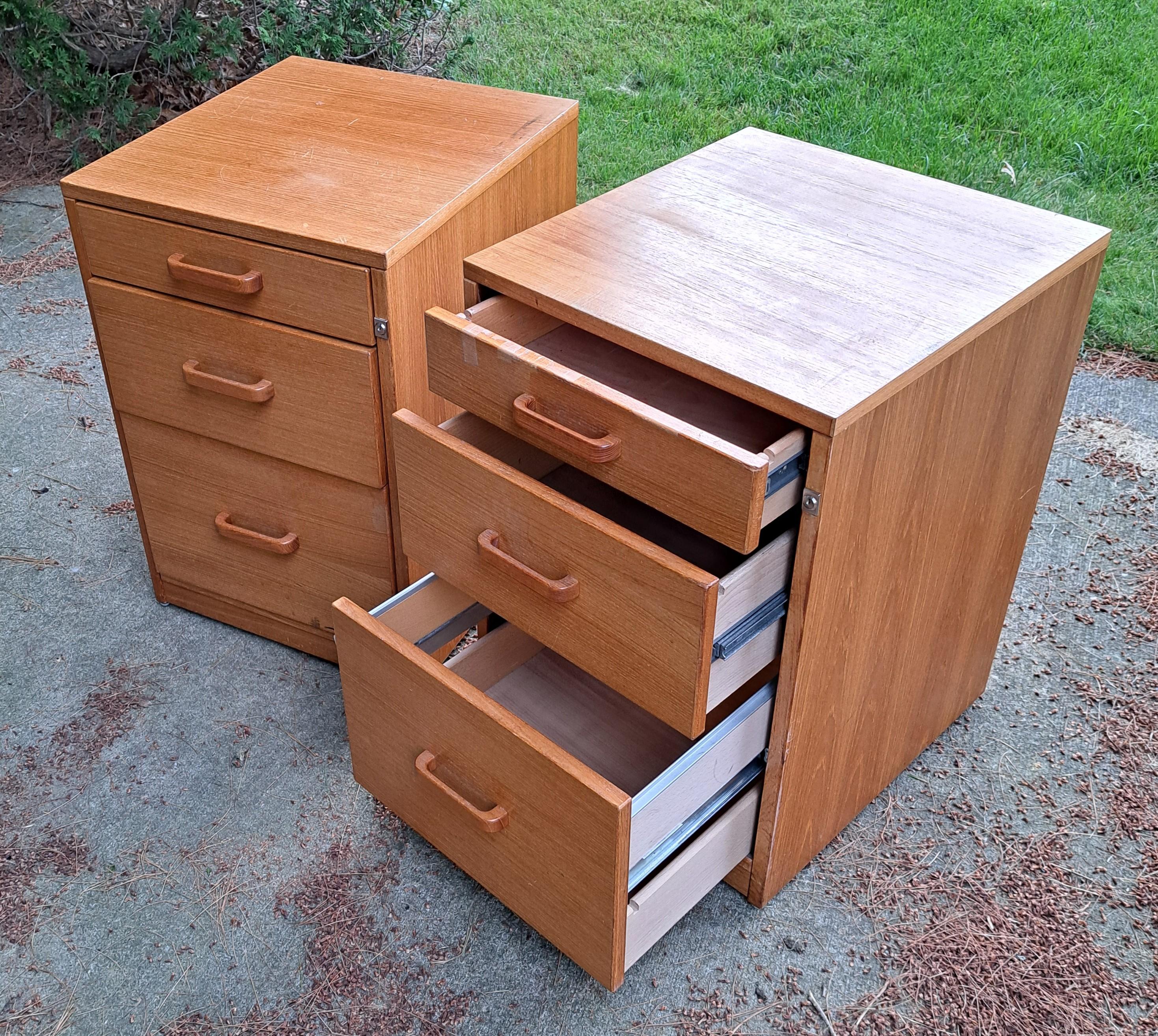 Pair of MCM Danish Modern teak wood three drawer filing cabinets.
