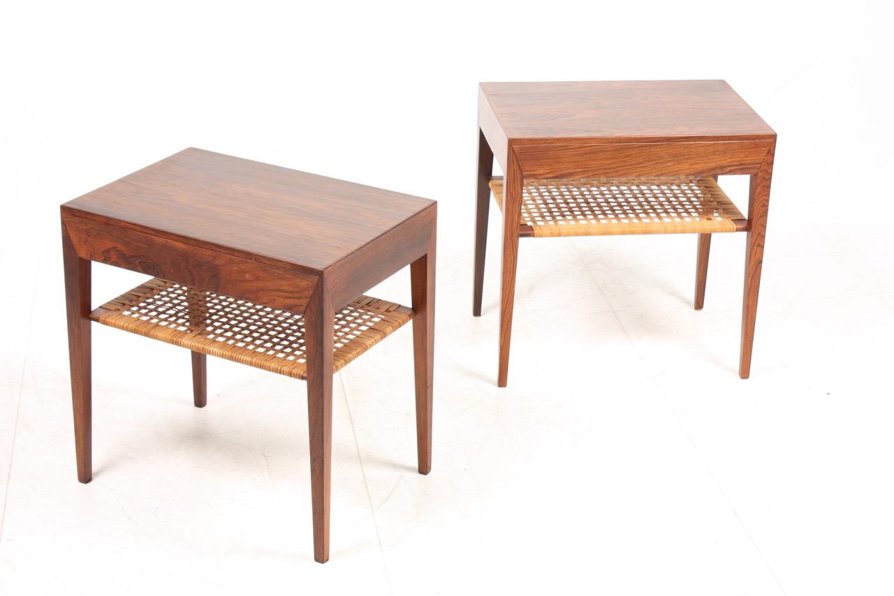Stunning pair of nightstands in rosewood and cane. Designed by Severin Hansen for Haslev Furniture of Denmark in the 1960s. Great original condition.
 