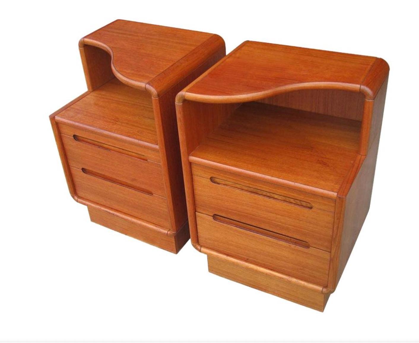 Pair of Mid Century Danish teak 2 drawer nightstands with top curved shelf.  Curved corners with curved cut out handles. Very nice quality and condition. Made in Denmark. Located in Brooklyn NYC.

Sold as a Pair - Set of (2) Nightstands 

Measures: