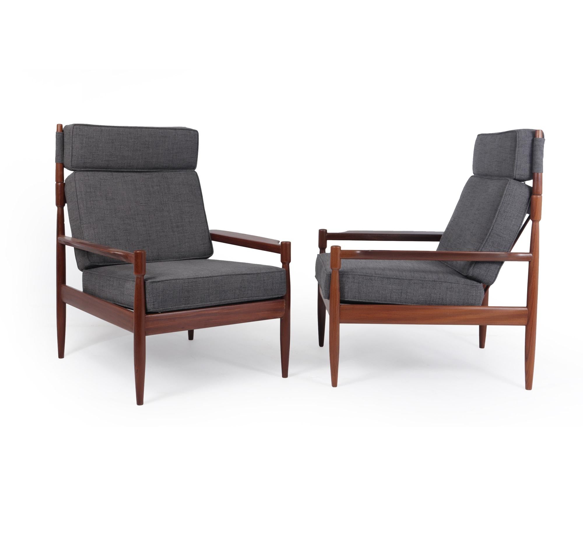 Pair of mid century Danish teak armchairs c1960

A Pair of Danish produced armchairs produced in solid Afromosia with good strong construction and very unusual and stylish with horned uprights to hold the head cushion, the frames have been fully