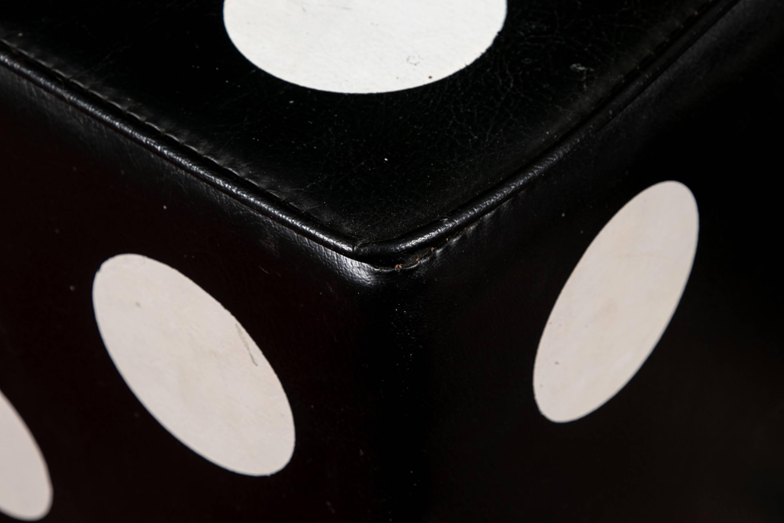 Pair of dice form square stools, leather or leather type vinyl in black with white dots, felt bottoms.

Condition: Expected wear and signs of use including some areas of light scuffing and a few minor tears.
 