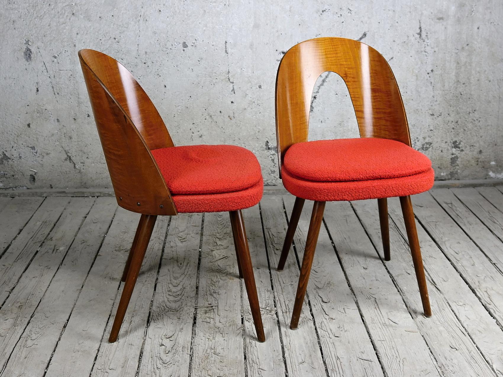 These chairs were designed by Antonin Suman, and were manufactured by the Tatra Nabytok Company, in the 1960s, in Czechoslovakia. Their red original fabric is still in good condition.
