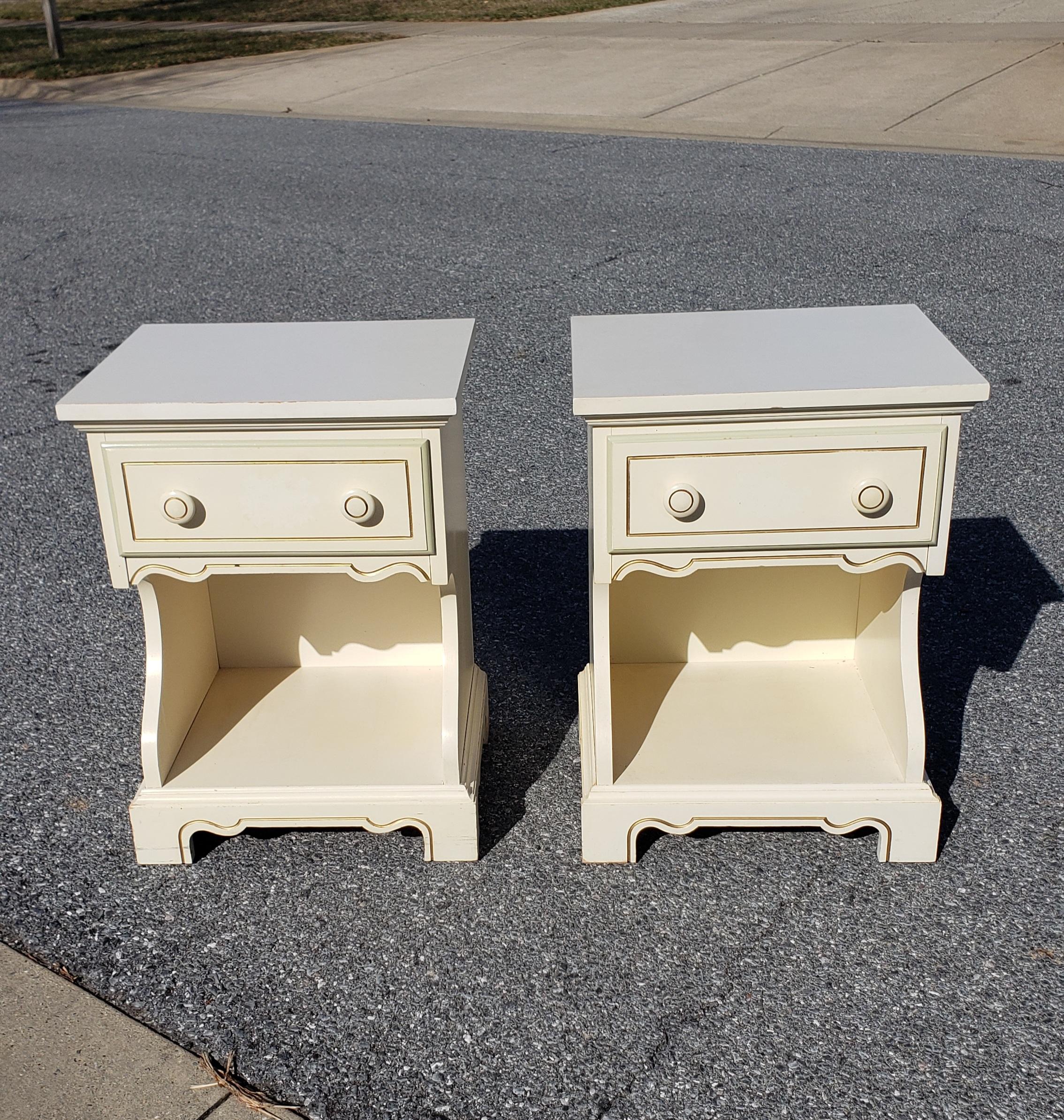 Pair of midcentury Dixie Furniture single drawer laminated top side tables measuring 18