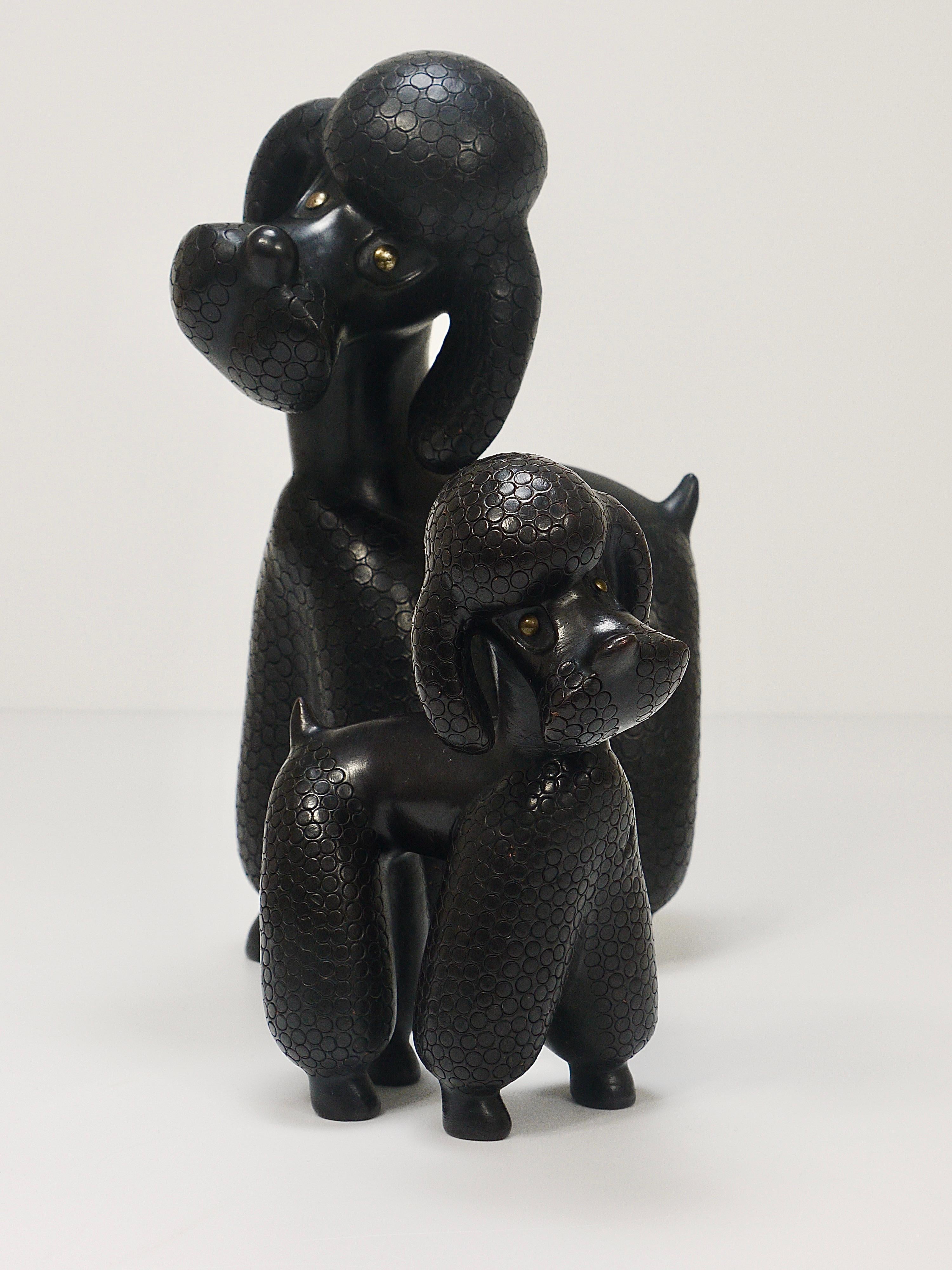 A pair of two lovely detailed Midcentury poodle figurines, called „Peggy
