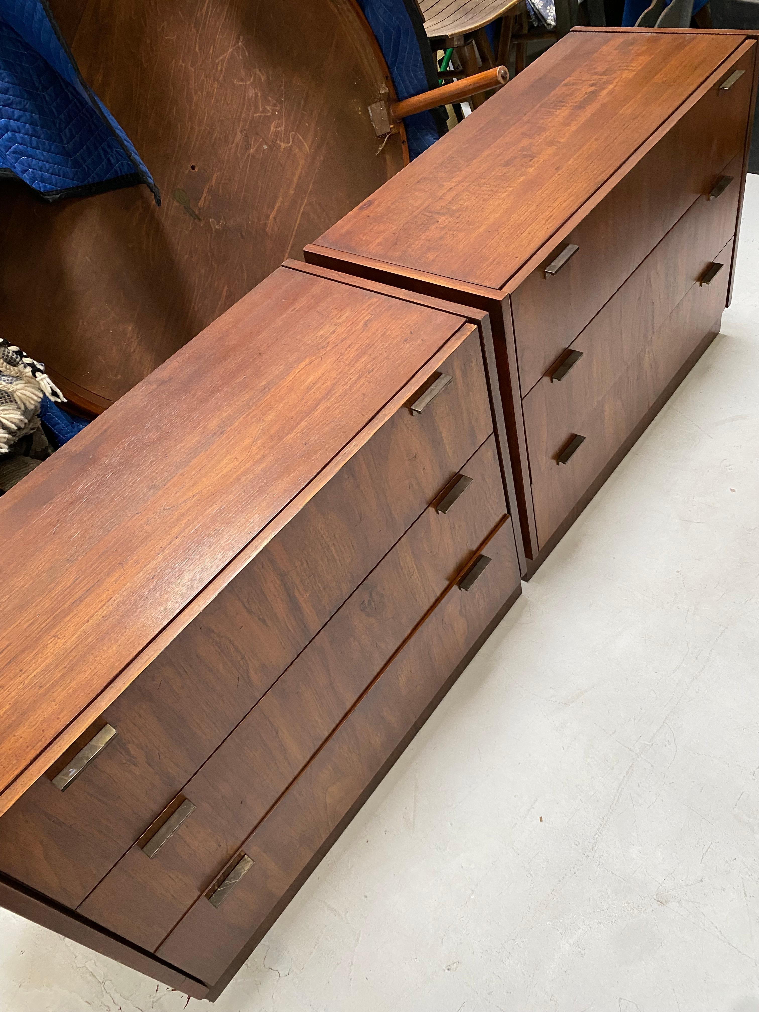 Amazing Mid-Century Modern dressers with metal hardware and beautiful dark stained wood. The perfect pair of dressers to bring a sleek modern look into your home!