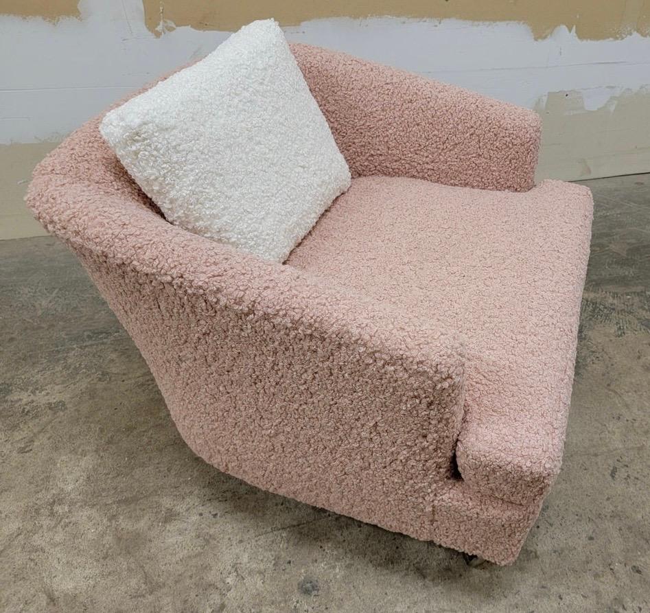 These tub chairs were produced in the 1970s by Drexel Heritage in the Carolinas. Attributed to Harvey Probber. Newly reupholstered in a blush pink shearling boucle. Snow White boucle was used on the back pillows. The chairs are designed for quick
