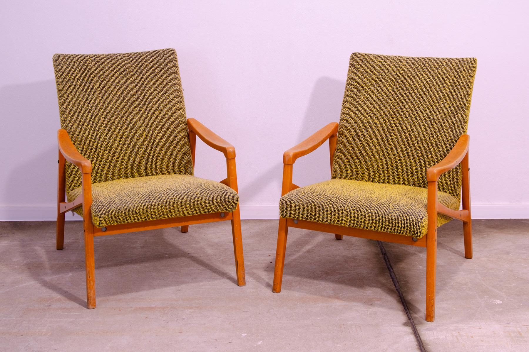 Pair of armchairs, made in the former Czechoslovakia in the 1970´s. It was designed by Jiří Jiroutek for Interiér Praha as part of U-550 living room set. The structure is made of beech wood and the chairs have original upholstery. The chairs are in