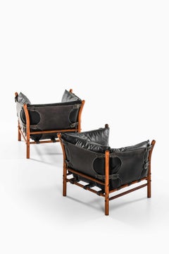 Pair of Mid Century Easy Chairs in Beech, Brass & Leather by Arne Norell, 1960s