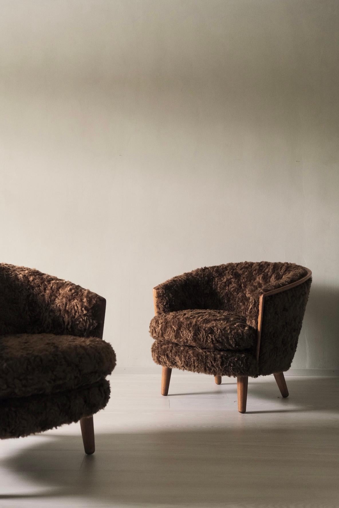 This is a beautiful pair of mid-century Egg Chairs designed by P.I. Langlo of Norway in the 1950s. These chairs have been newly reupholstered in a luxurious longhair mohair fabric in a rich silky brown color, designed by Raff Simmons and supplied by