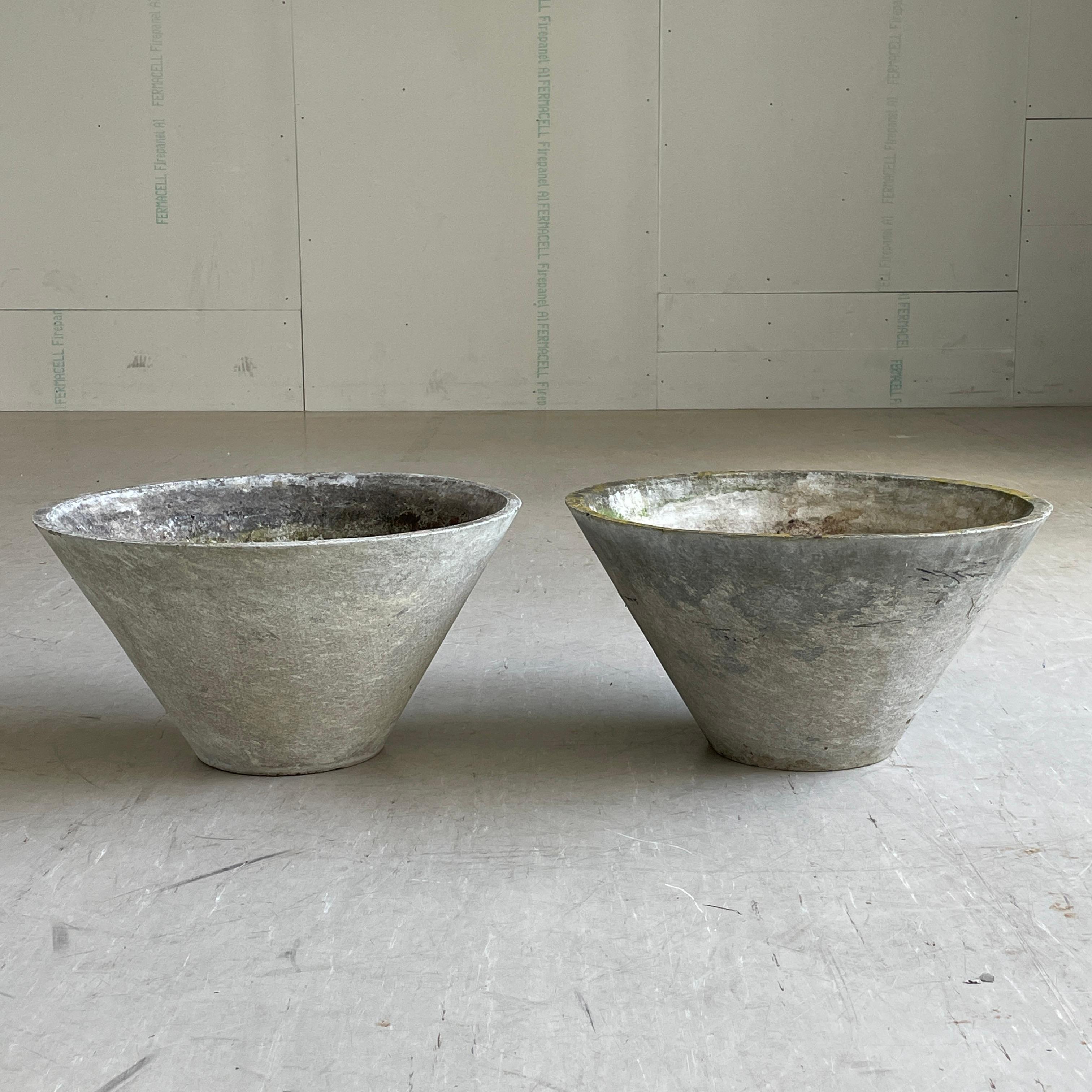 Pair of mid century minimalist conical concrete flower pots by prominent Swiss interior architect and furniture designer, Willy Guhl (* 6. Juli 1915 in Stein am Rhein; † 4. Oktober 2004 in Hemishofen). 
Solid concrete made in Switzerland 1955 -
