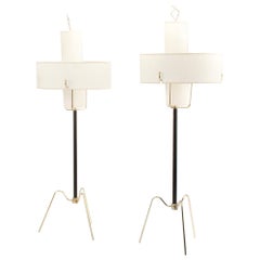 A pair of midcentury modern brass and gilt iron floor lamps with drum lampshades