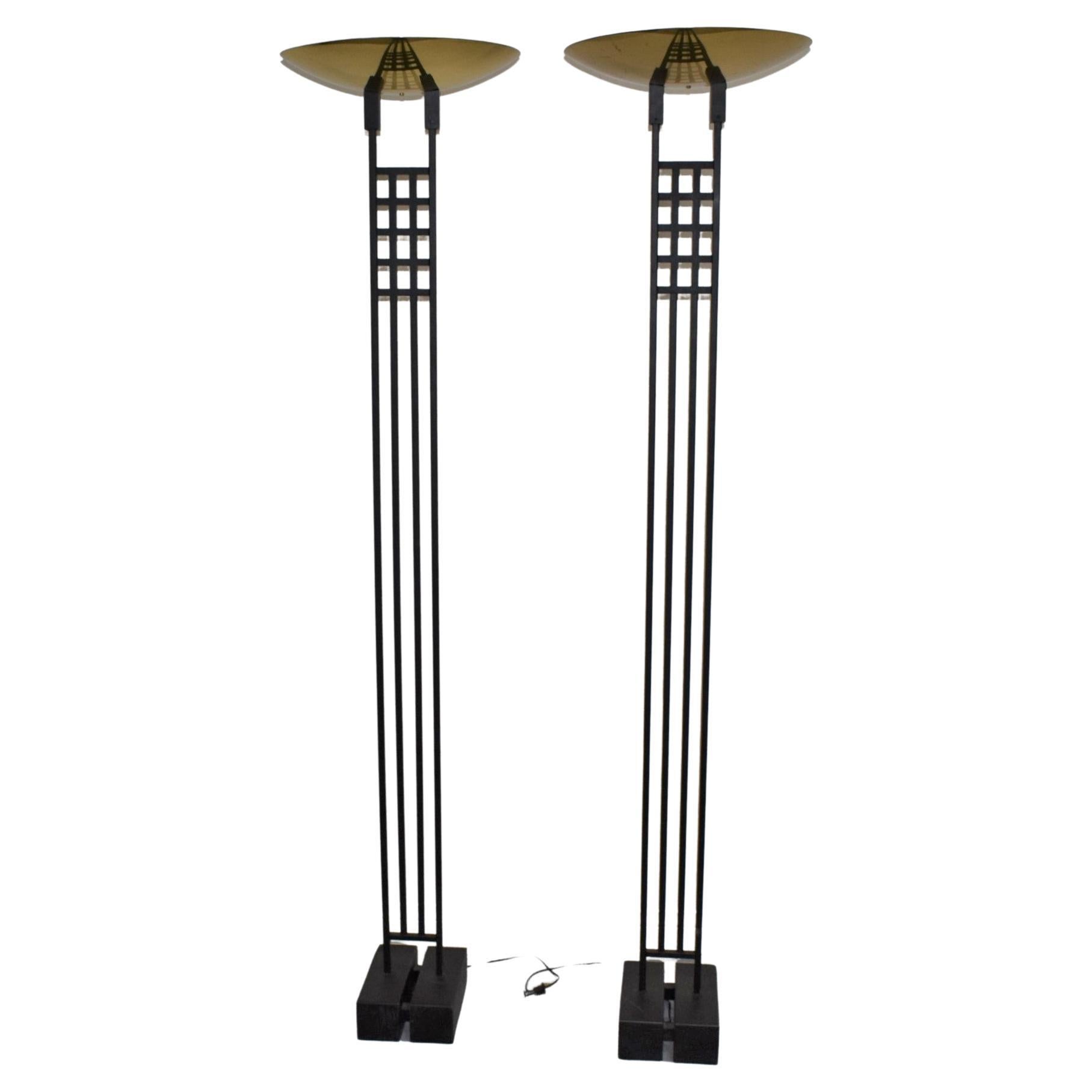 Step into the 1980s with our beautifully restored pair of Mid-Century Modern floor lamps. Expertly crafted from a harmonious blend of brass and metal, these lamps are in impeccable condition, resonating with the era's signature design. The lamps'