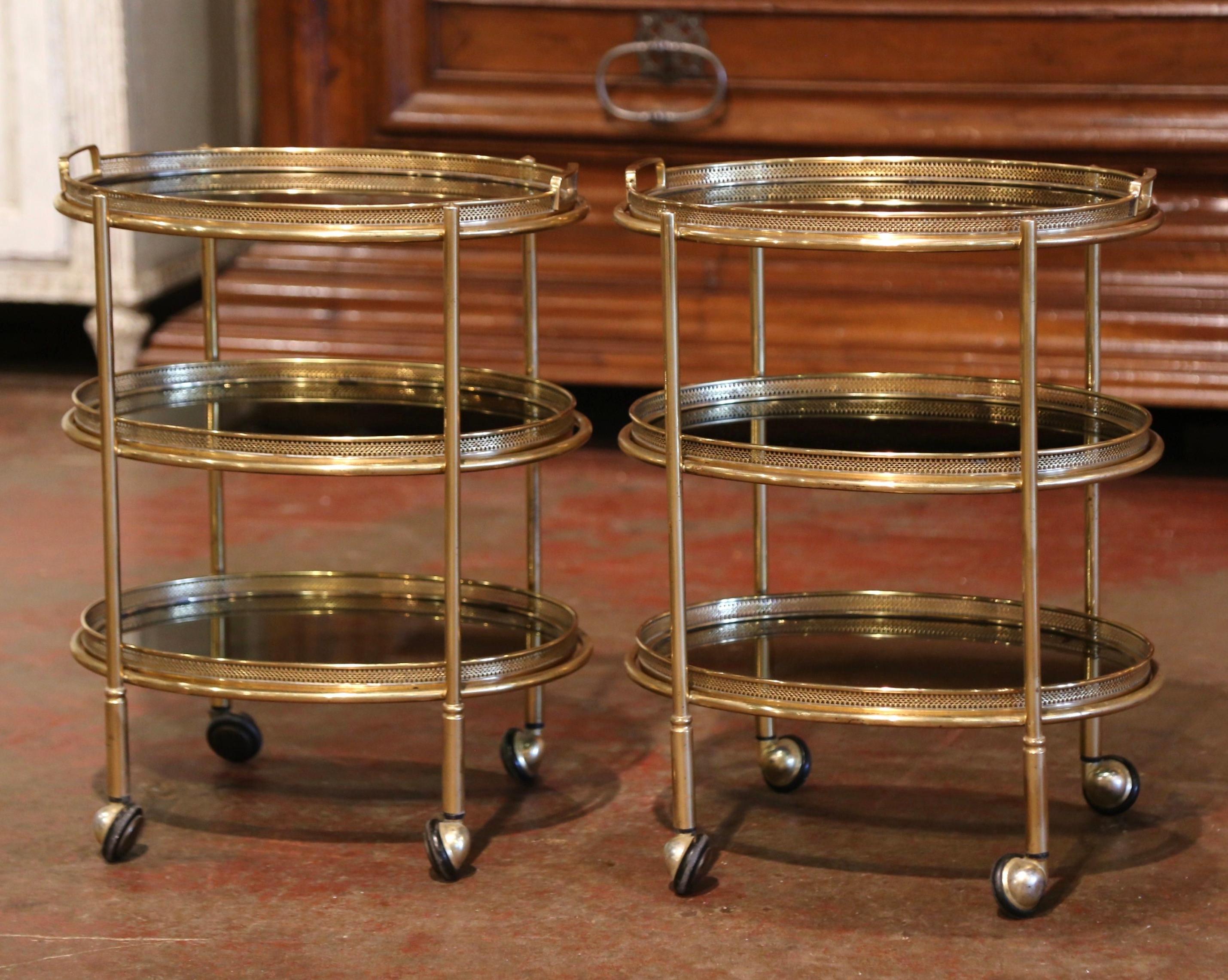 Pair of Mid-Century French Brass and Smoked Glass Three-Tier Service Bar Carts In Excellent Condition In Dallas, TX