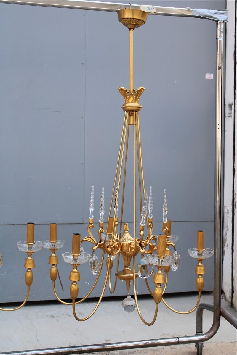 Pair of extraordinary and unique French chandeliers from the mid-1900s, made of 24KT gold plated brass, satin parts, crystals of exceptional quality, attributed to the manufacture of Maison Jansen France.

Each chandelier features 6 E14 Max 40