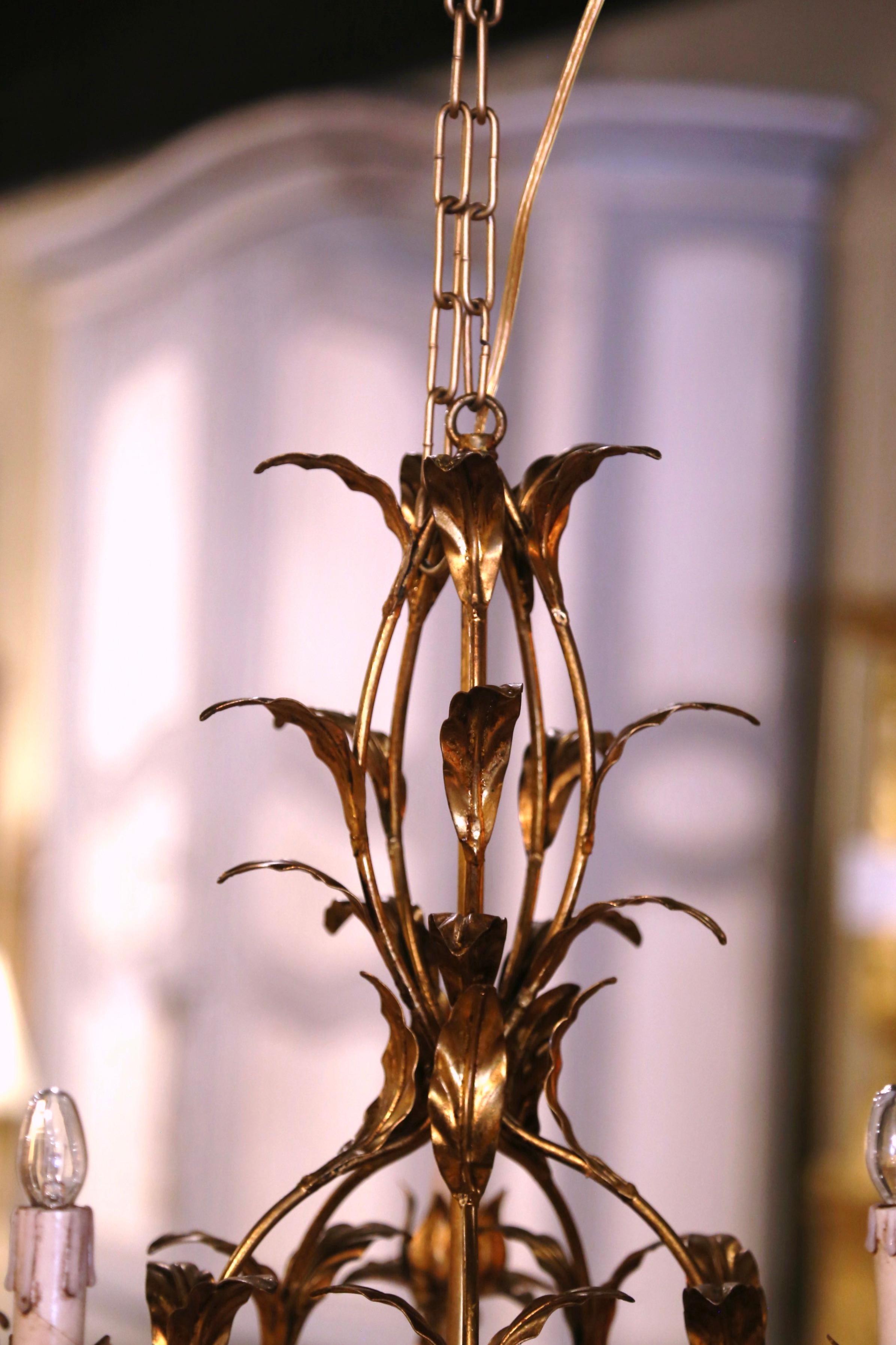 Hand-Crafted Pair of Mid-Century French Gilt Metal Six-Light Chandeliers with Leaf Motifs