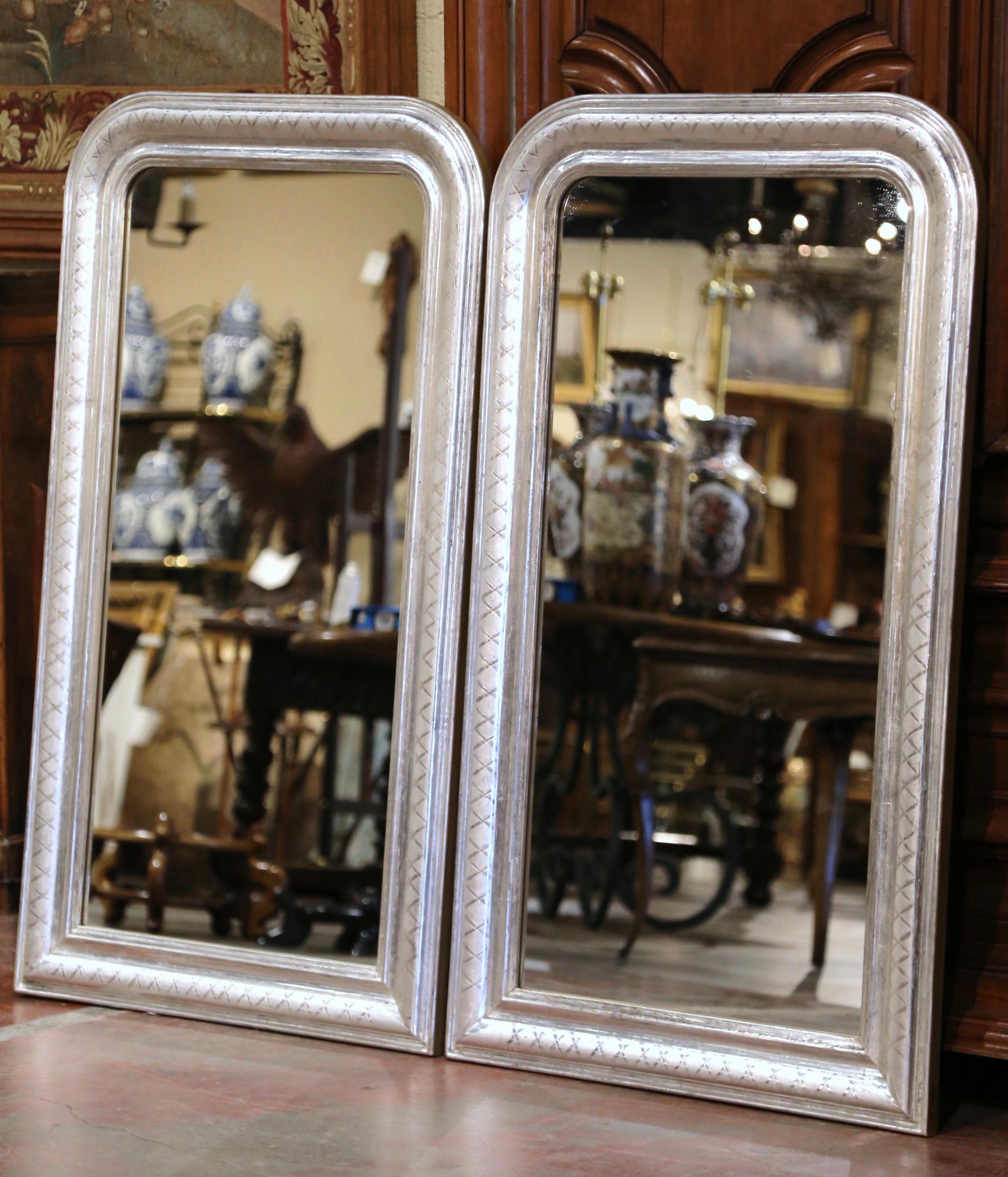 Decorate a master bathroom or entry with this elegant pair of antique wall mirrors. Crafted in the Burgundy region of France, circa 1950, and rectangular in shape, the mirrors have traditional, timeless lines with rounded corners. The frames are
